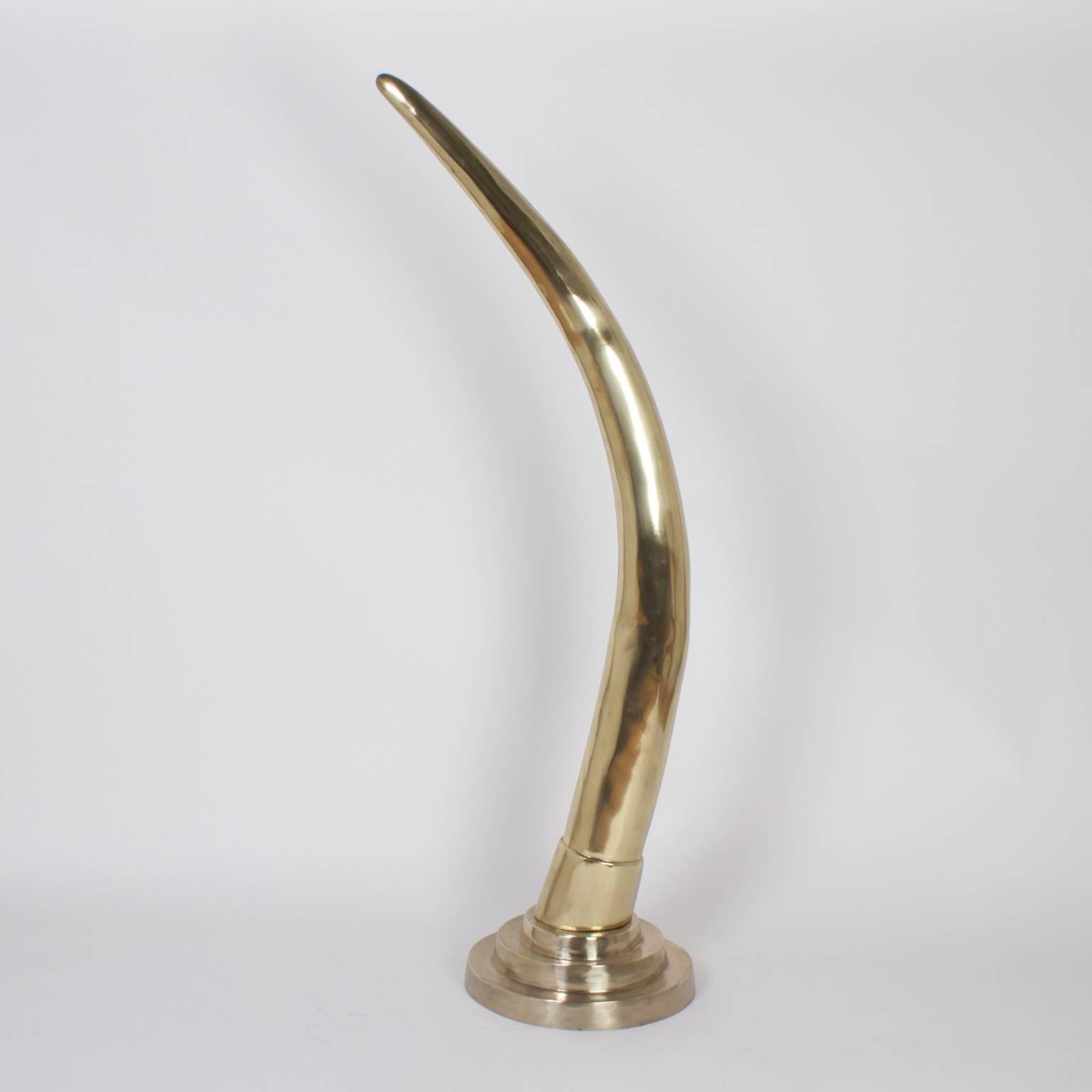 Bold pair of midcentury cast brass elephant tusks with plenty of decorative punch. These impressive objects have a strong presence that will enhance any style interior. Hand polished and lacquered for easy care.

 