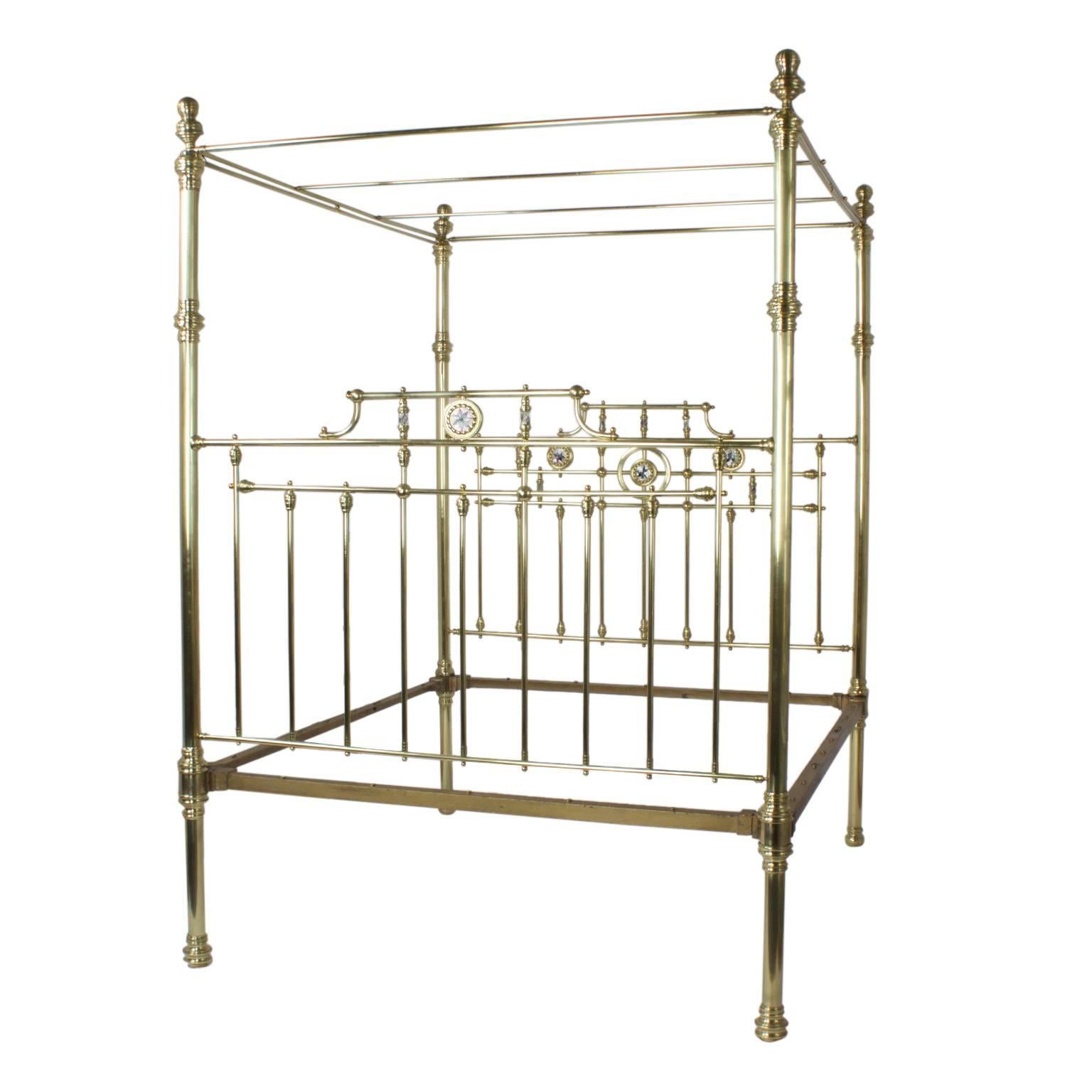 Inspired, bold antique super queen size English brass bed or daybed with an optional side panel. This luxurious bed features side curtain rods, mother of pearl medallions on the head and foot board, and over a century of history. Hand polished and