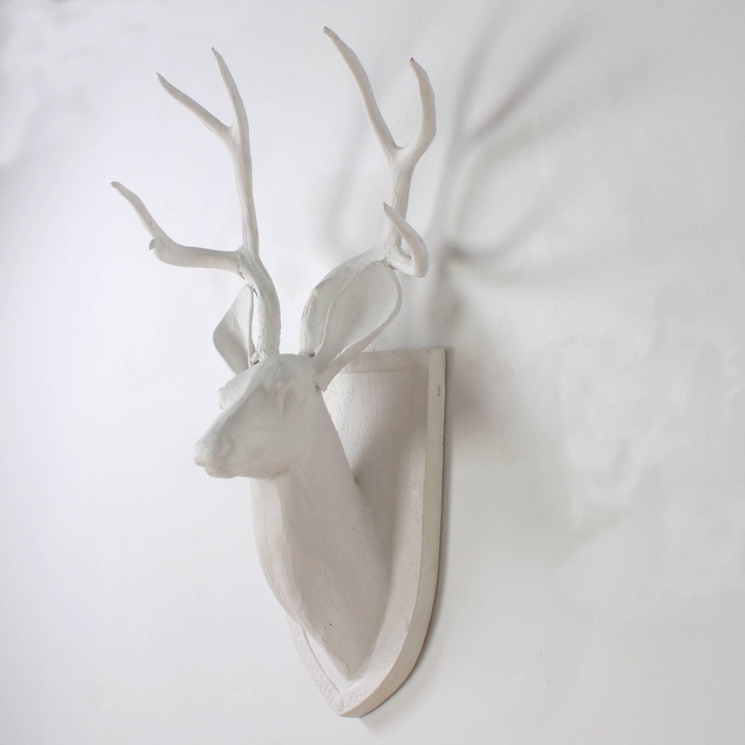 Chic, Mid-Century cast aluminum deer head complete with antlers and a shield-shaped plaque. An interesting hip, modern version of an ancient IDEA.

  