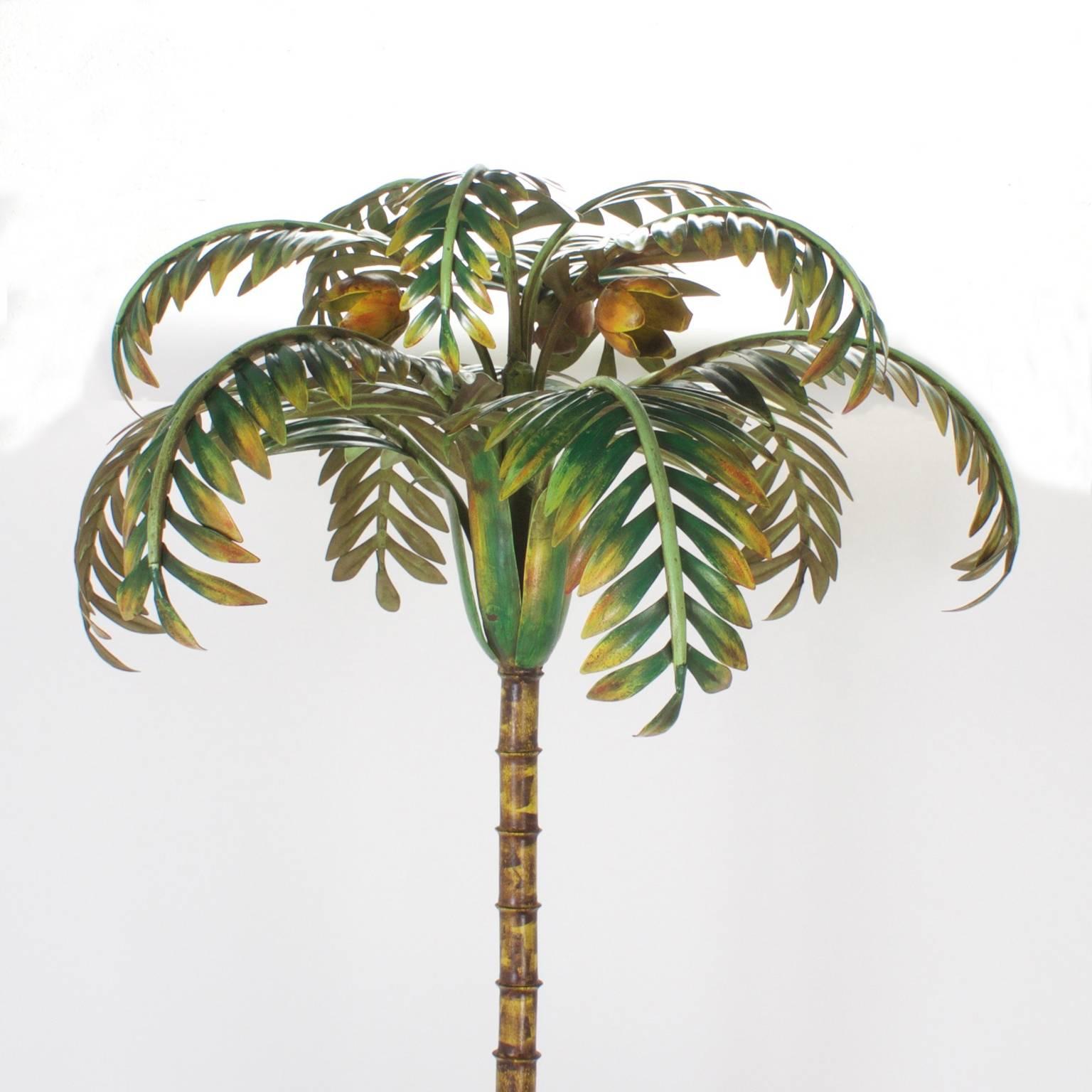 Lush, colorful painted iron or tole palm tree composed of four palms in assorted stages of maturity. The base is hand-wrought three roots. Perfect for island, coastal or any type of living that needs a bit of whimsey. We have a similar palm tree,