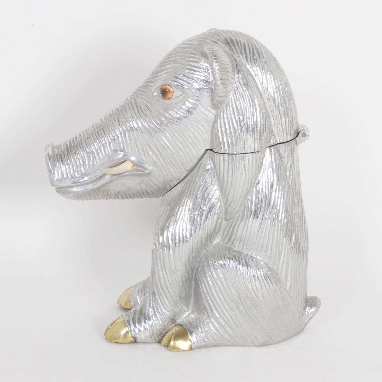 Amusing warthog wine cooler crafted with aluminum and sporting brass feet and a pair of stone eyes. Designed in the Mid-Century and signed Arthur Court, 1982 on the bottom.
   