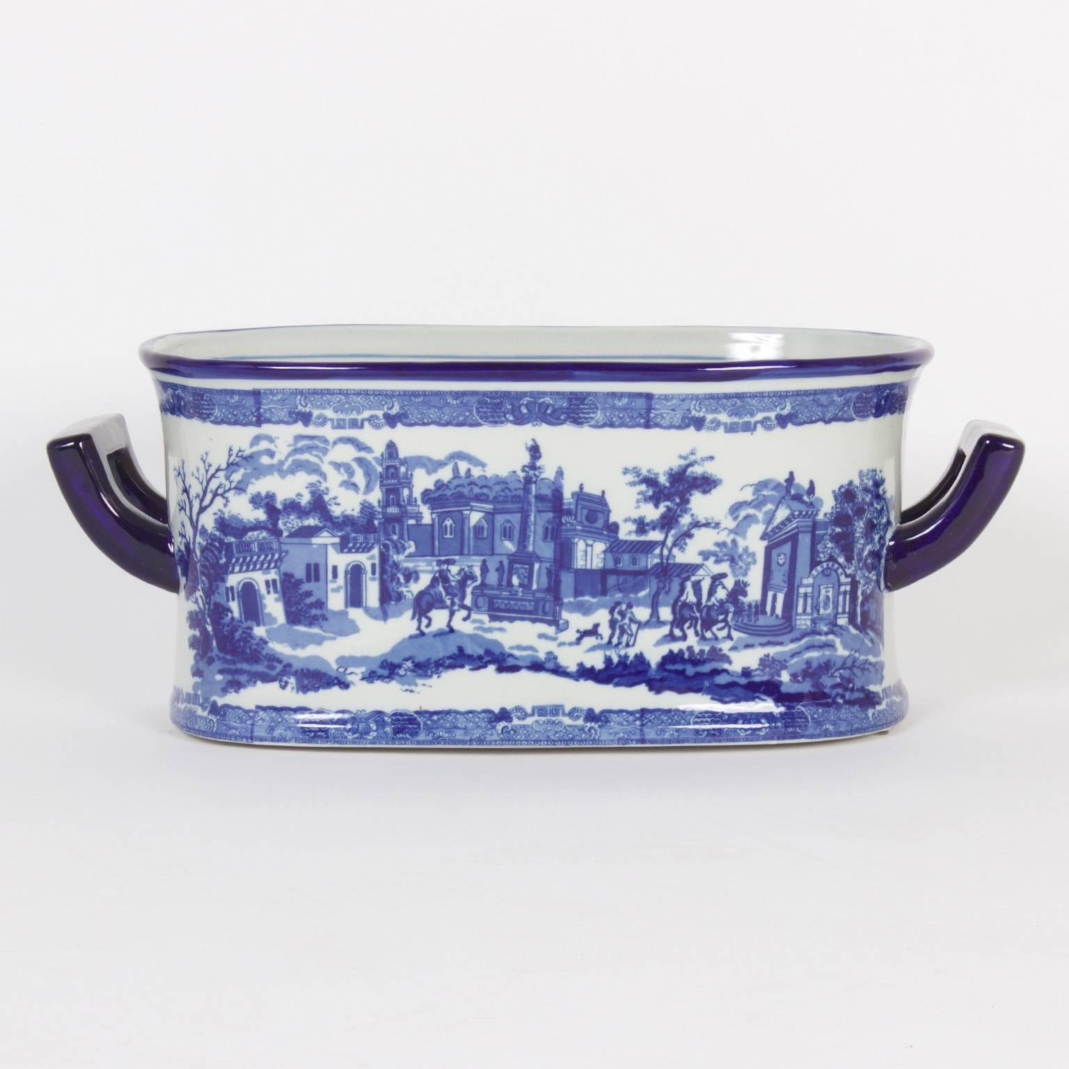 Blue and white porcelain Staffordshire style oblong planter or foot bath decorated in the manner of Chinese export, portraying an 18th century European street scene. Perfect for an orchid display.

.