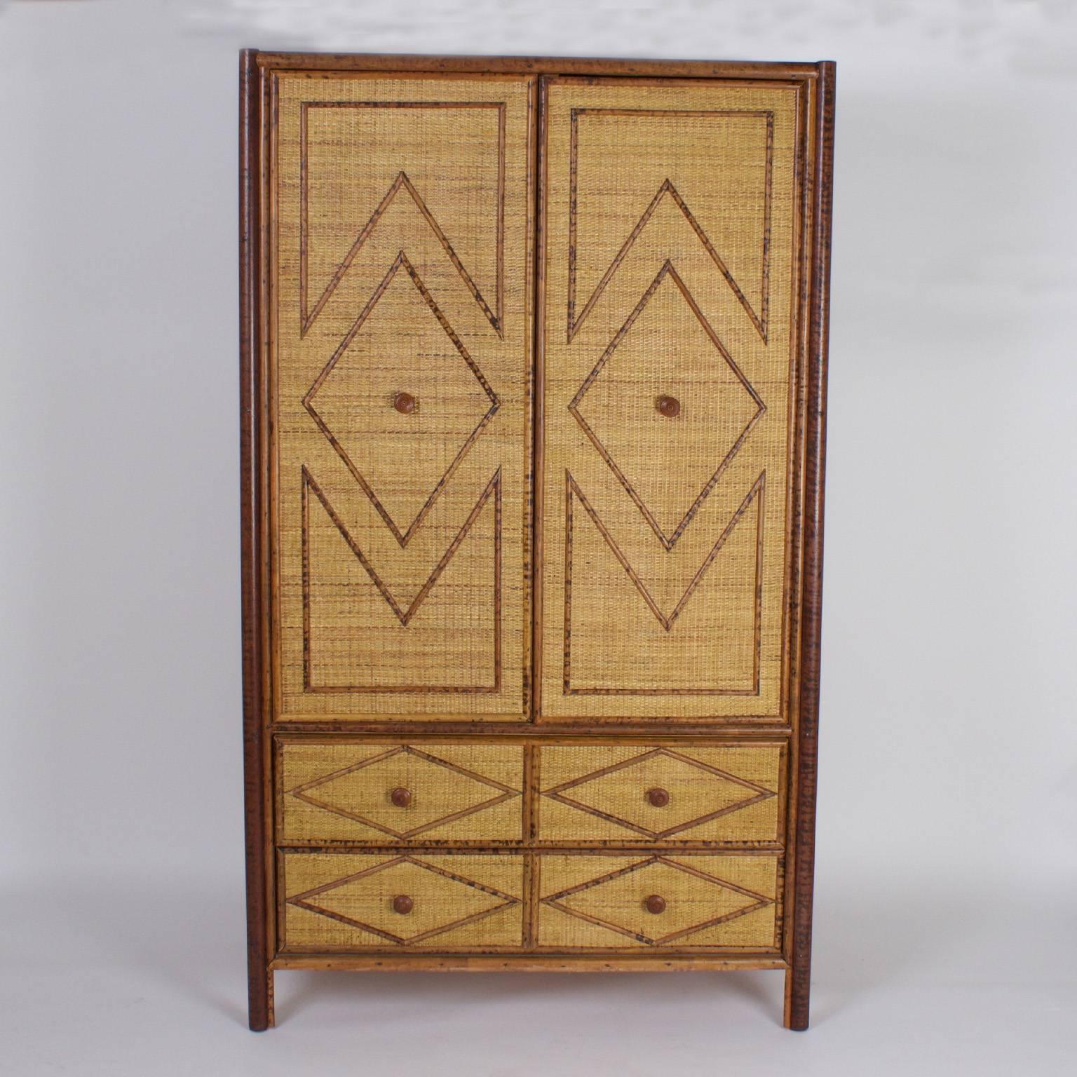 Mid-Century armoire or cabinet crafted with faux bamboo and grass cloth with two doors four drawers for plenty of storage. Featuring dramatic Art Deco style designs on the front and sides, over an earthy, textural background.
 