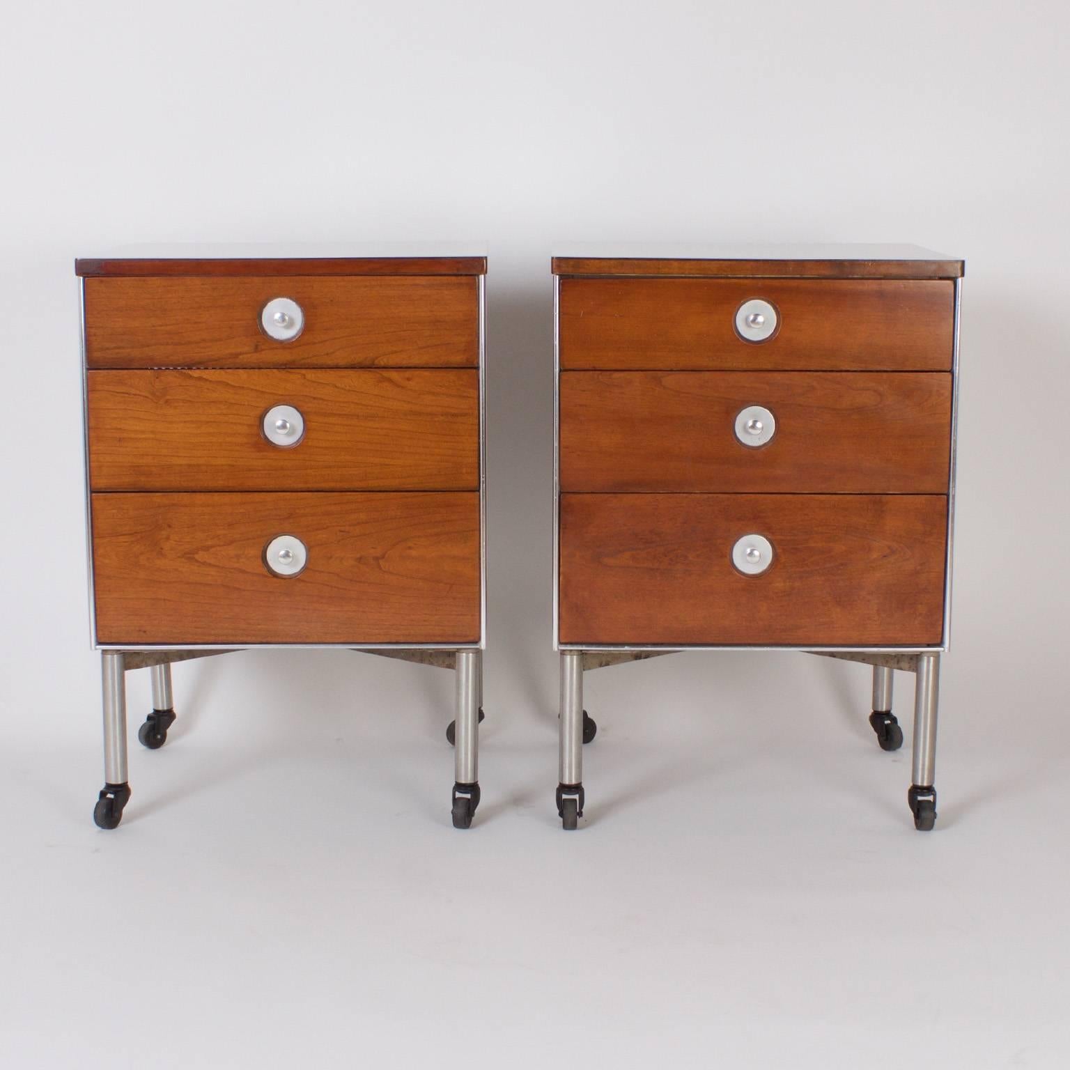 Dashing pair of three-drawer nightstands or chests that confidently mix textures of walnut with aluminum and influences of Mid-Century modern with Industrial. Designed by Raymond Loewy for Hill-Rom as labeled in a drawer.

  