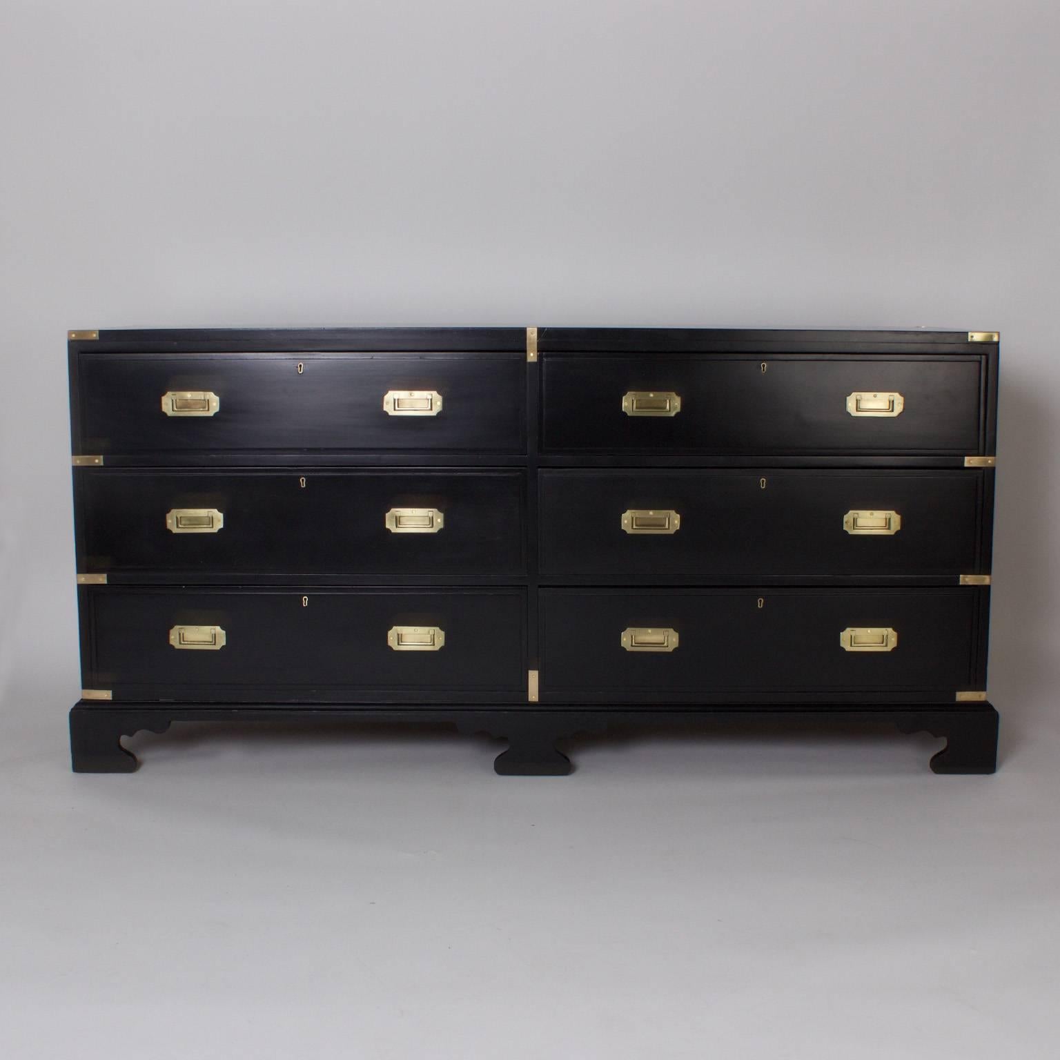 Rare and unusual 19th century double dresser or chest with an ebonized finish, campaign hardware, bracket feet, and a strong stylish presence that defies comparison.