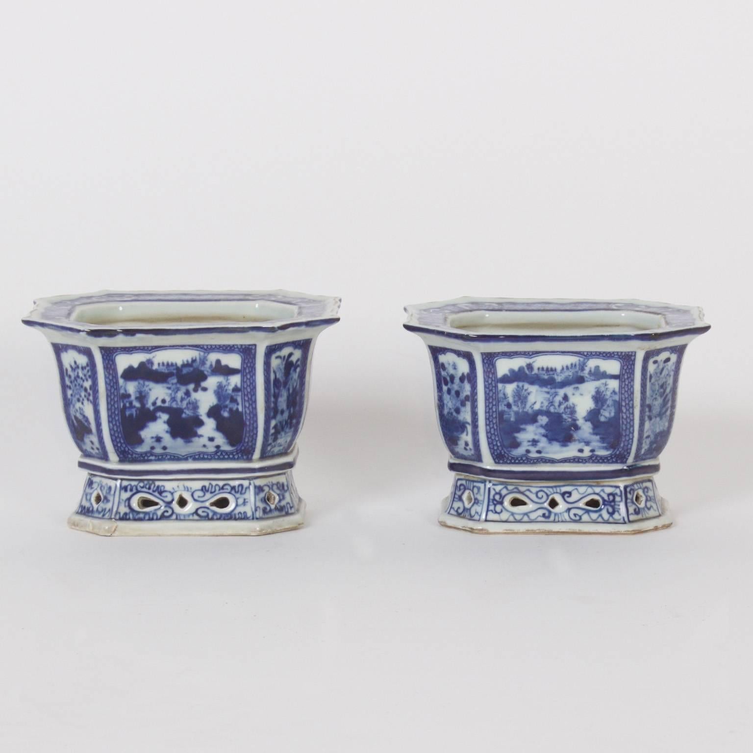 Diminutive and fine Chinese blue and white porcelain planters with a scalloped, rectangular, octagonal form and alternating floral and landscape decorated panels.
 