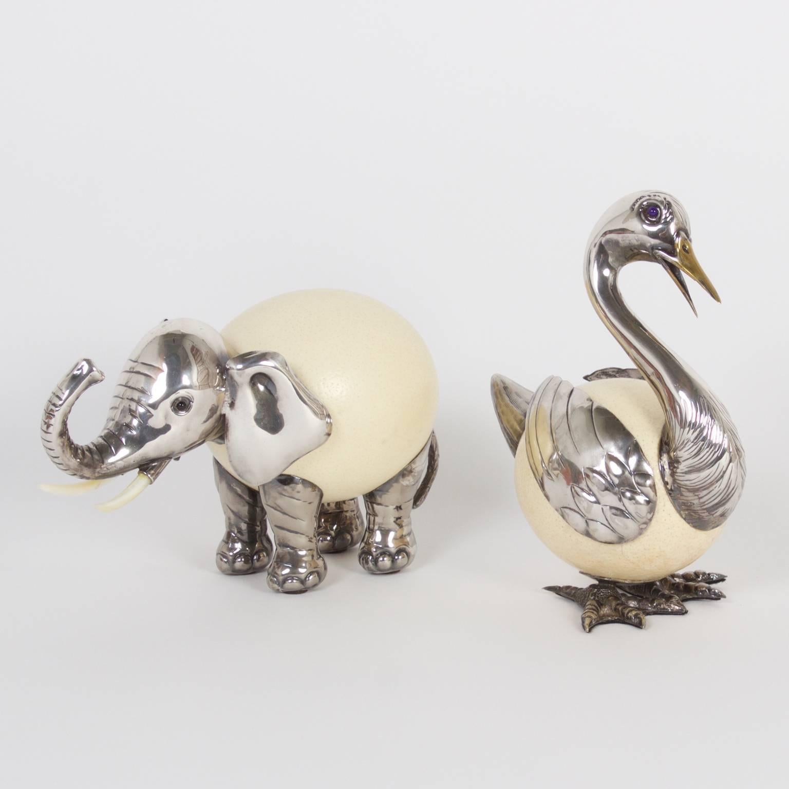 Amusing Binazzi animal sculptures, one an elephant and one a duck, both crafted with an ostrich egg and silvered metal. Both figures are signed with an impressed mark on the metal. Priced individually. 

From left to right:

Ref: 4058 H: 7 W: 12 D: