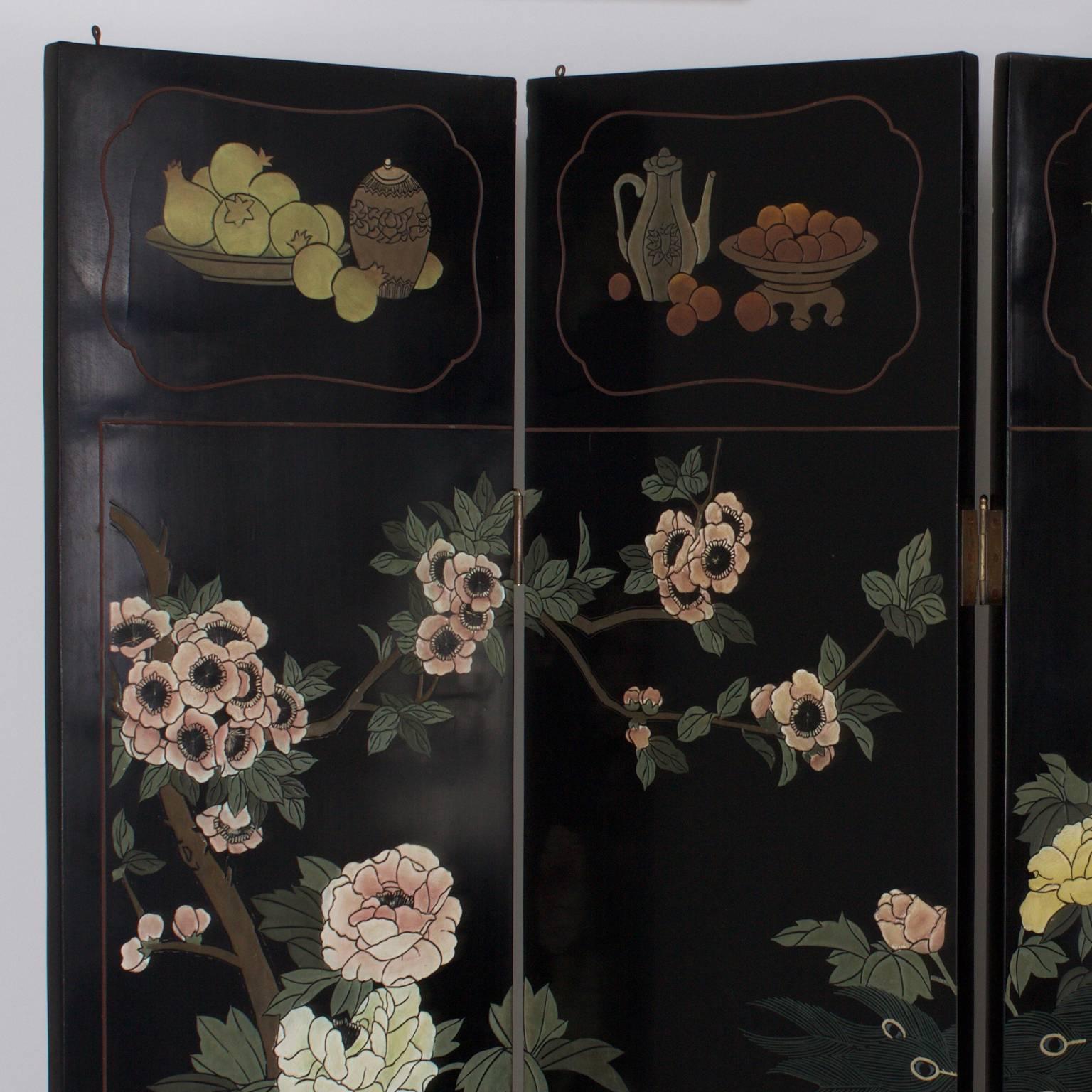 Chic, Mid-Century six panel Chinese screen with a Classic black background under delightfully colorful paintings of flowers, bamboo, birds and fruit baskets. This screen can be hung on a wall or Stand on its own. One of two available.