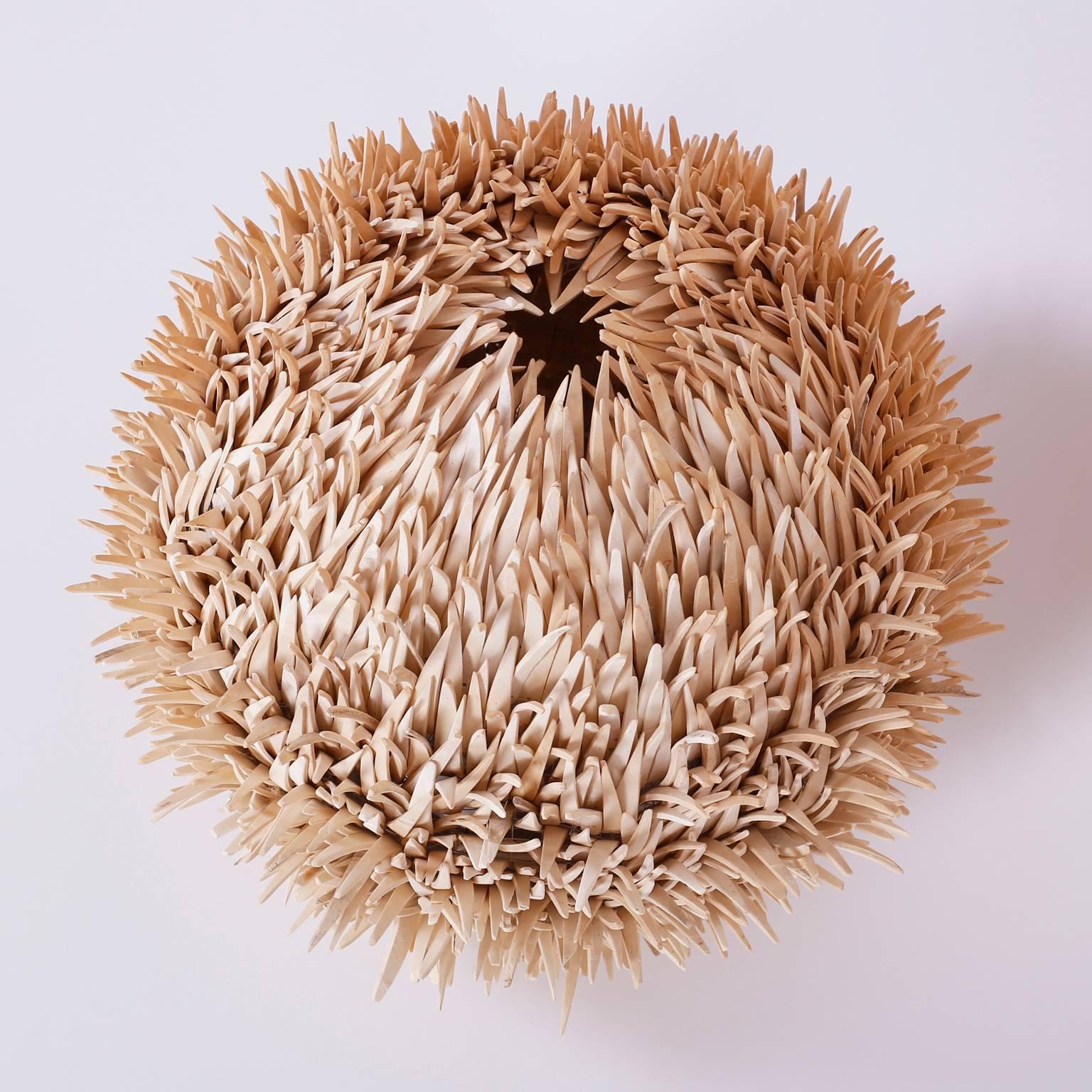 Bold and amusing sea urchin table lamp with strong sculptural values. Crafted with strips of leather or tile over a metal frame supporting a one bulb socket.
            