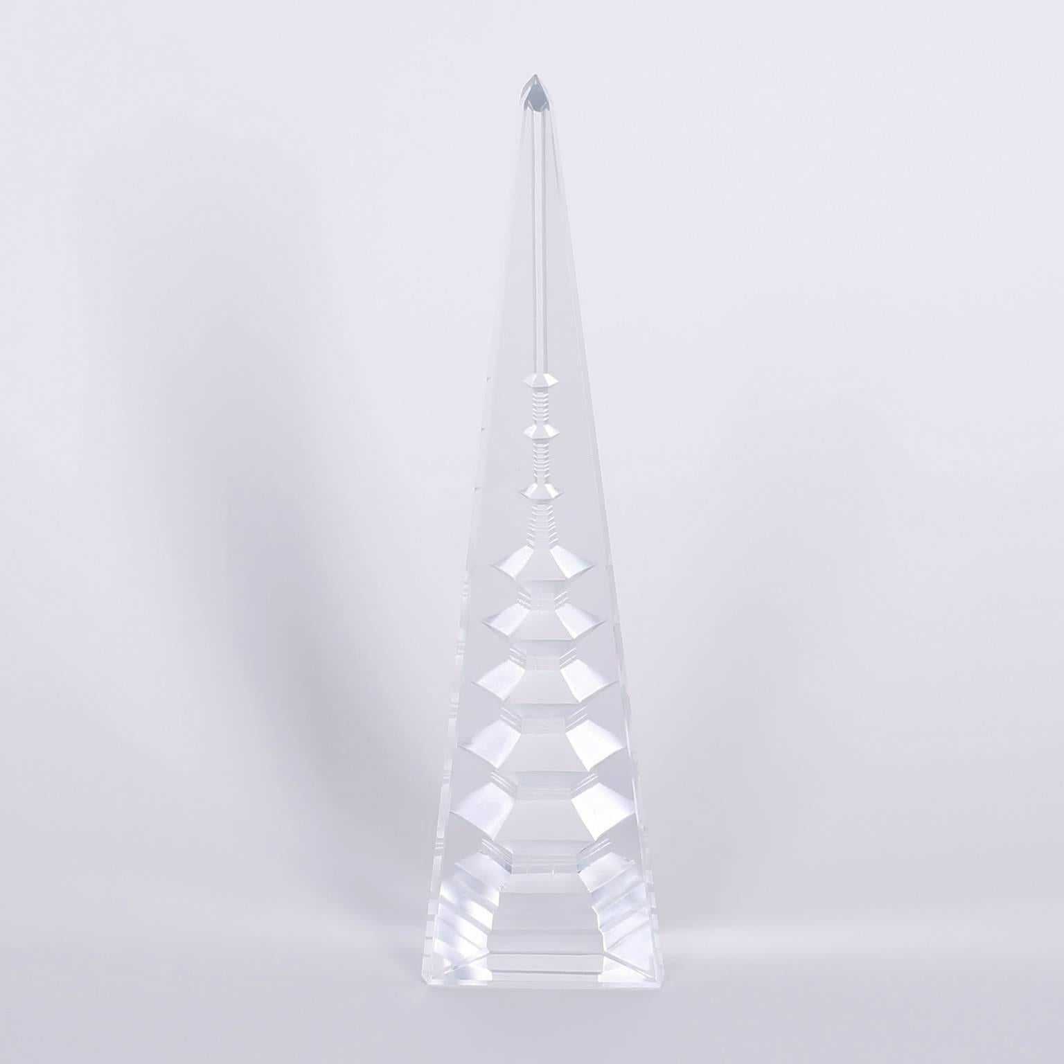 Here are three cut crystal obelisks with the unexpected pagodas appearing inside. By cutting stylized geometrics into the back the results in the fronts are truly magic.
 