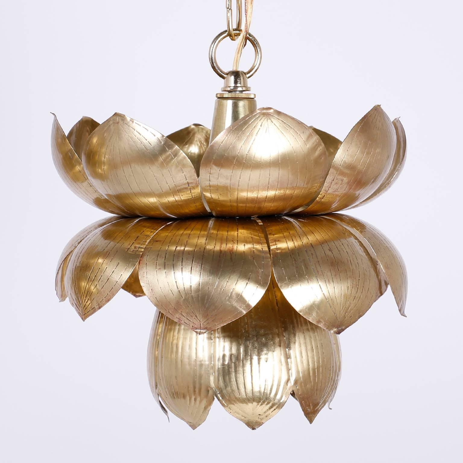 Six individual exotic lotus lights or pendants crafted in brass with a one bulb socket inside. Wired hand polished and lacquered for easy care and sold separately. Probably Feldman.