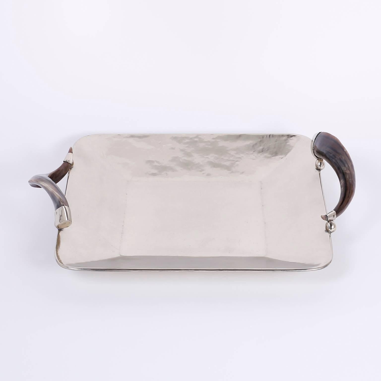 Chic, silver plate on brass serving tray with steer horn handles. Polished and lacquered for easy care.
 