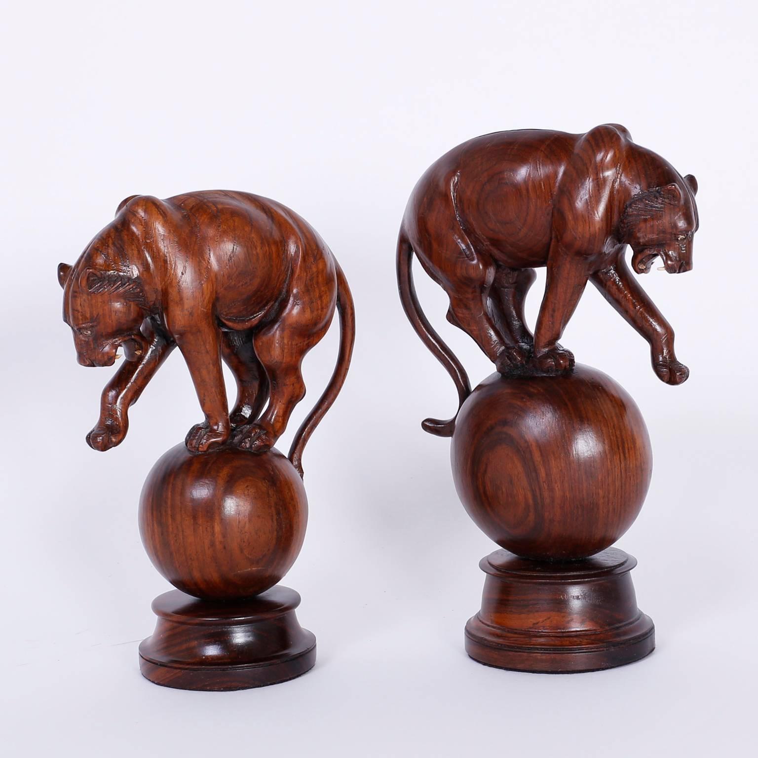 Here are two sculptures or object de art that tantilize our fascination with big cats. Expertly carved with care and know how from mahogany, these tigers seem frozen in time as they performed in a circus or side show long ago.

Measures: H 9.5, W