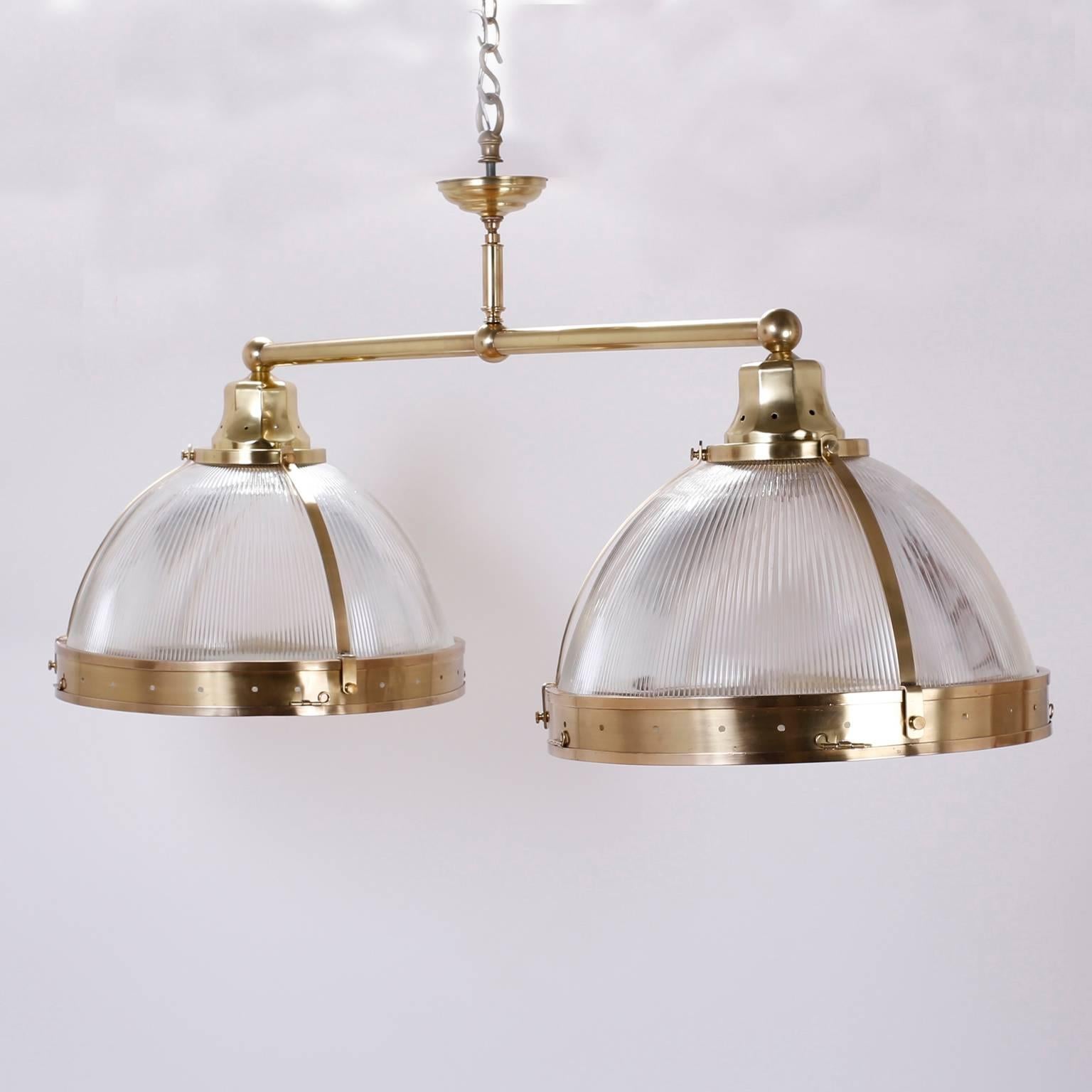 Chic double dome chandelier or pendant light fixture that is both elegant and industrial. The dome glass is ribbed for a lustrous glow; the glass on the bottom has the peaceful pattern of water. Hand polished and lacquered for easy care. Newly wired.