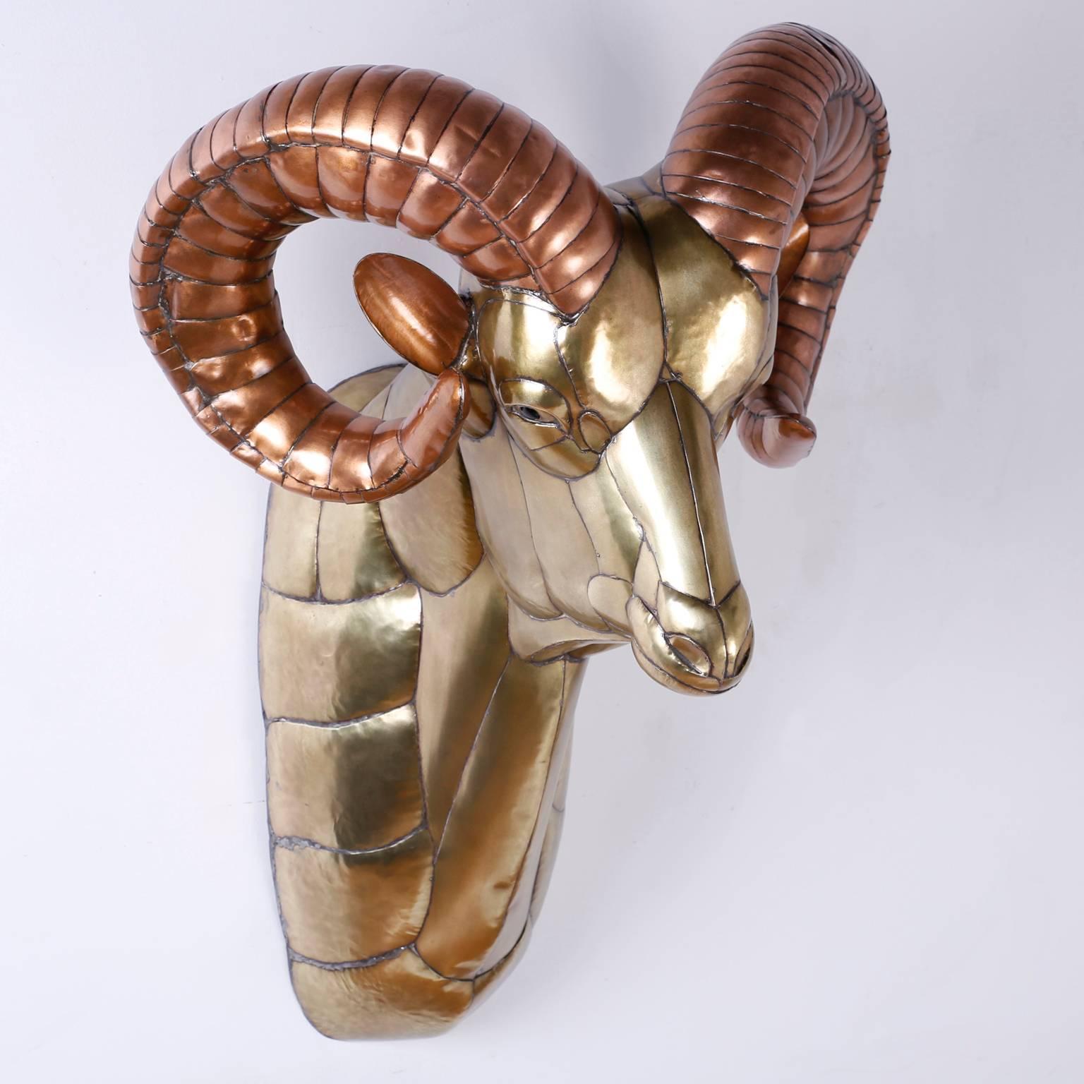 Bold and inspired Bustamante sculpture portraying a ram's head, crafted in copper and brass pieces that are welded together in a rather impressive puzzle.