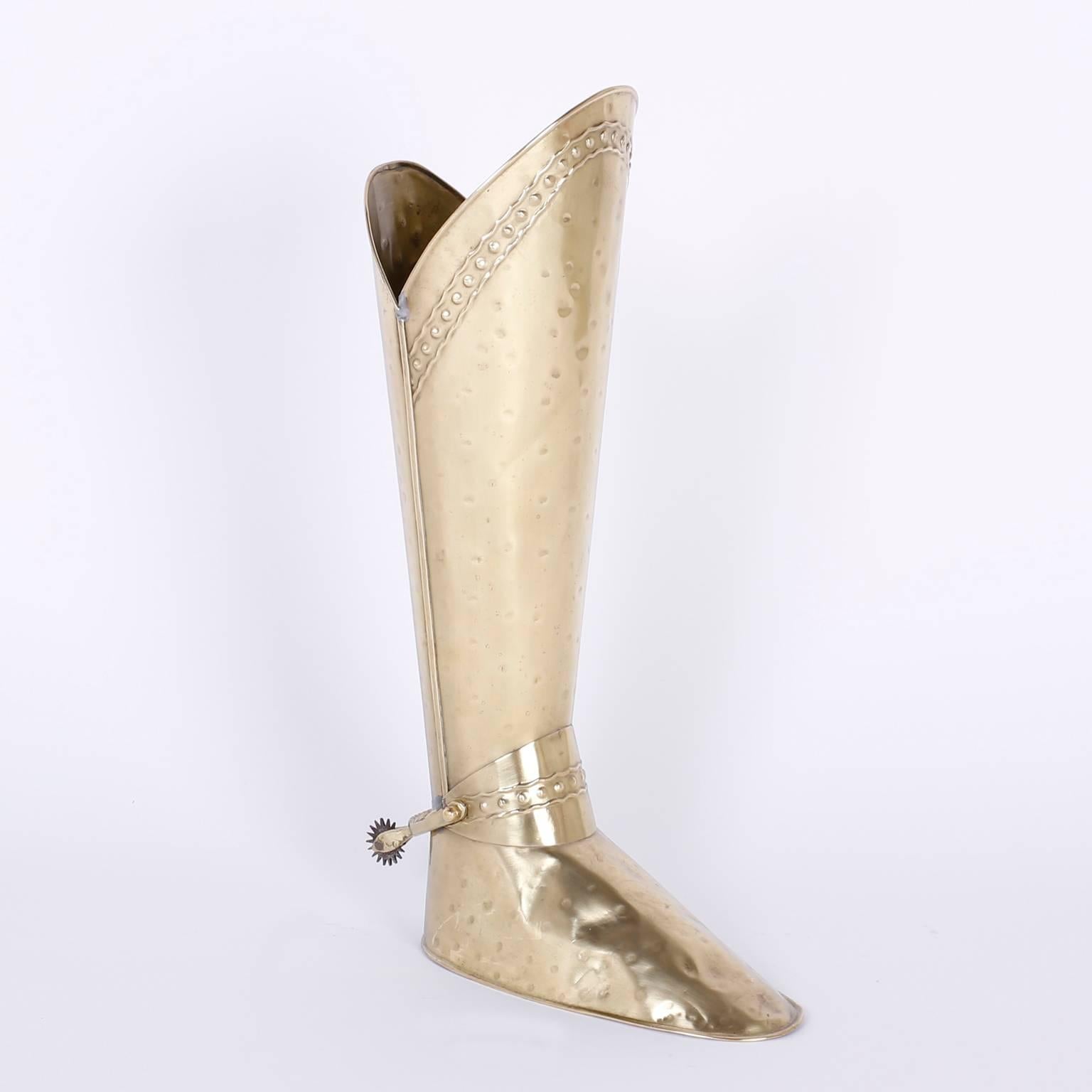 Fanciful hand-hammered brass umbrella stand in the form of a boot, complete with spurs.
 