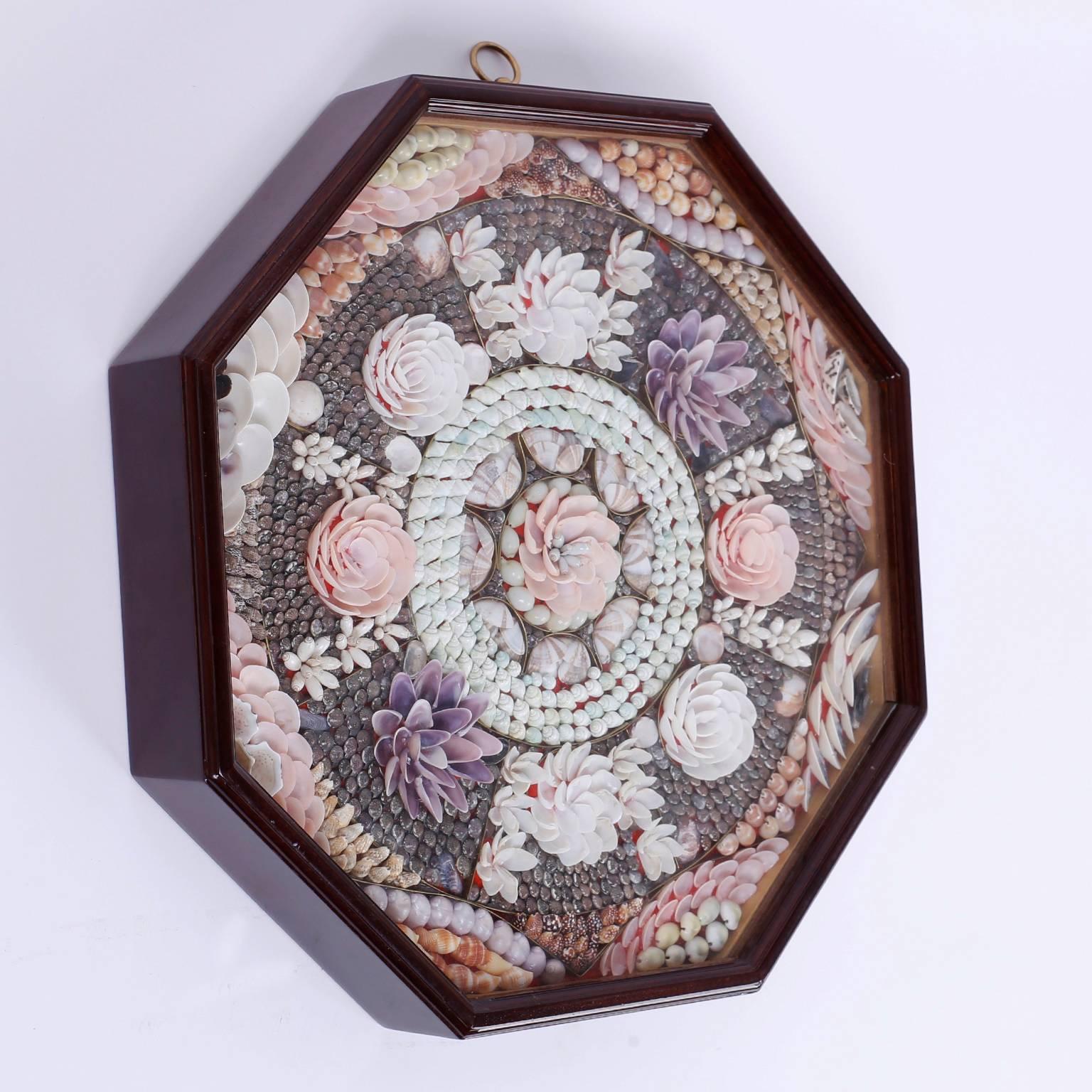 Lofty sailors valentine with a floral theme, lovingly crafted with a myriad of shell species and presented in an octagon shaped mahogany box.
 