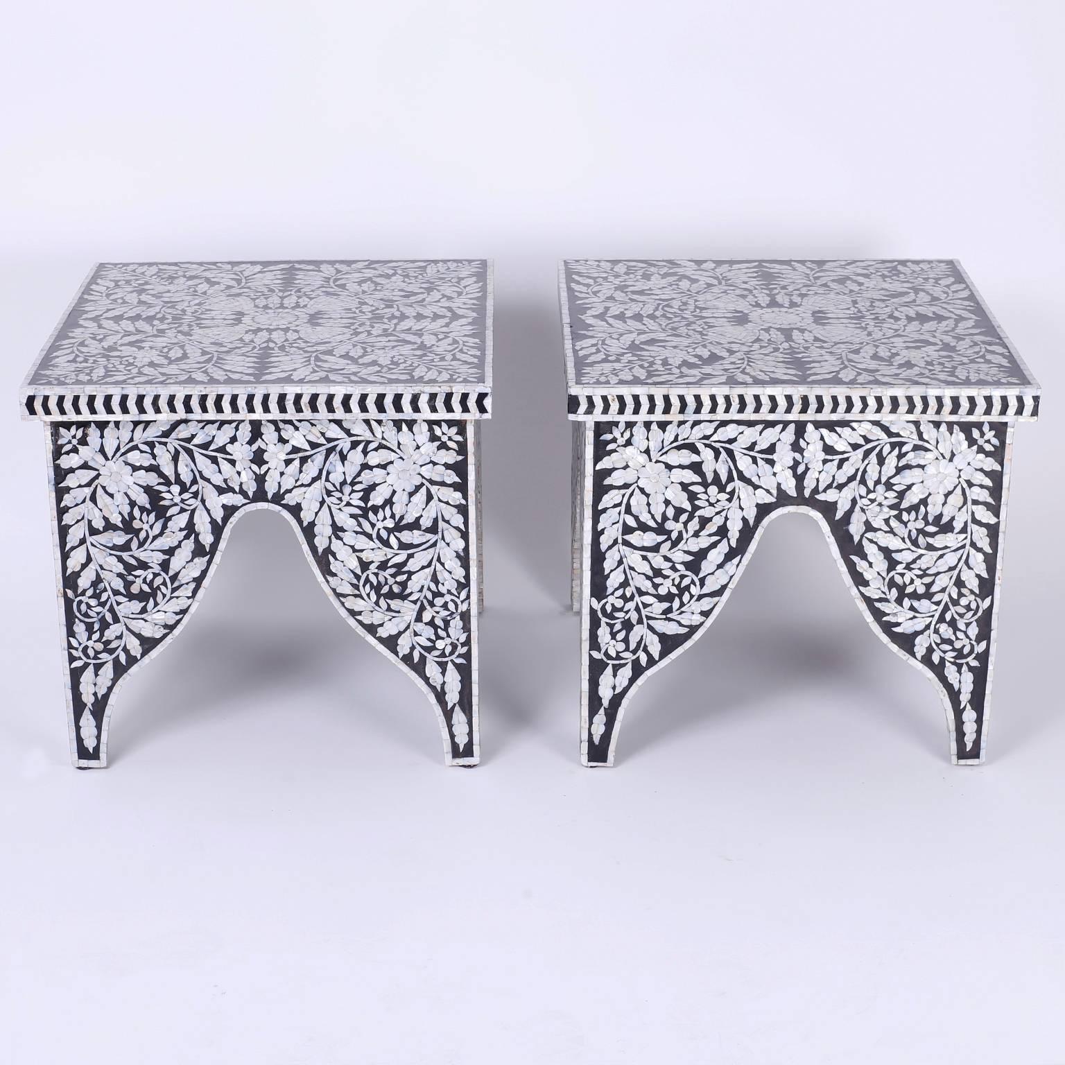 Rare pair of midcentury Anglo-Indian tables that can function as end or occasional tables. The square tops are decorated with a delightful and elaborate floral design as are the bases, which feature alternating architectural arches.