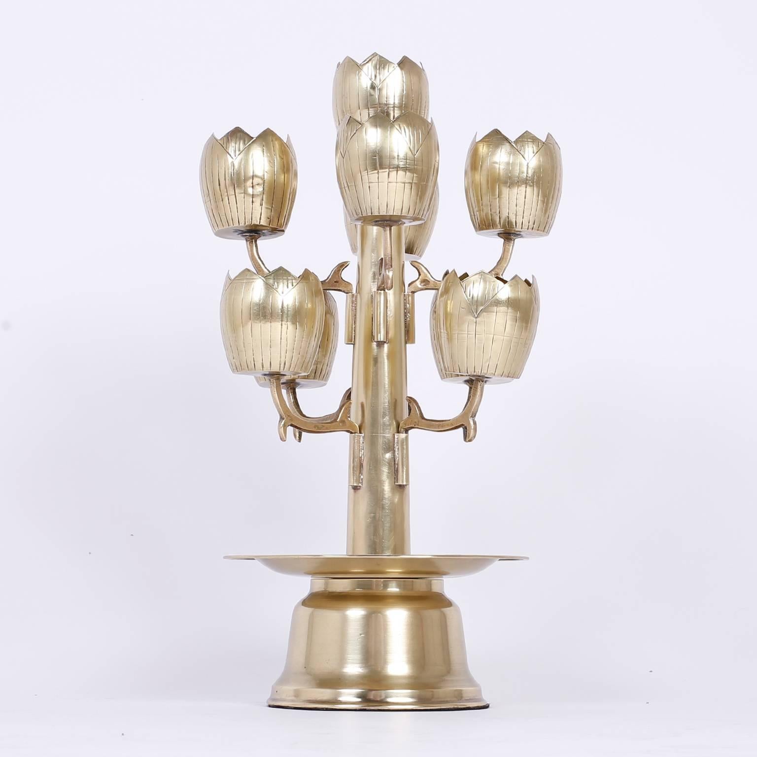 Set a romantic mood with this unusual midcentury brass candelabra having seven tulip or lotus flowers designed to hold votive candles. Hand polished and lacquered for easy care.
