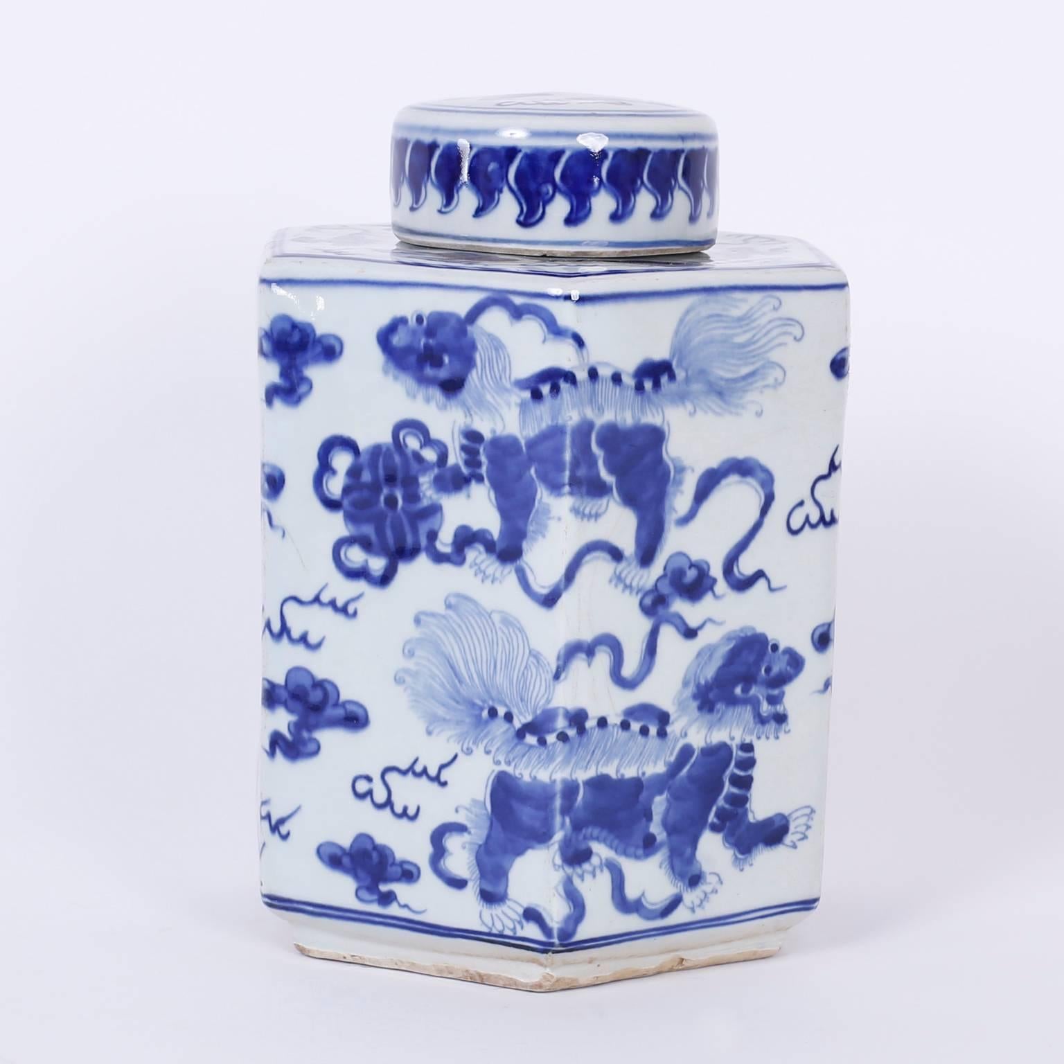 Spirited pair of Chinese export porcelain style tea leaf jars decorated in the Classic blue and white with foods and flowers. The containers are hexagon shaped with round lids.
