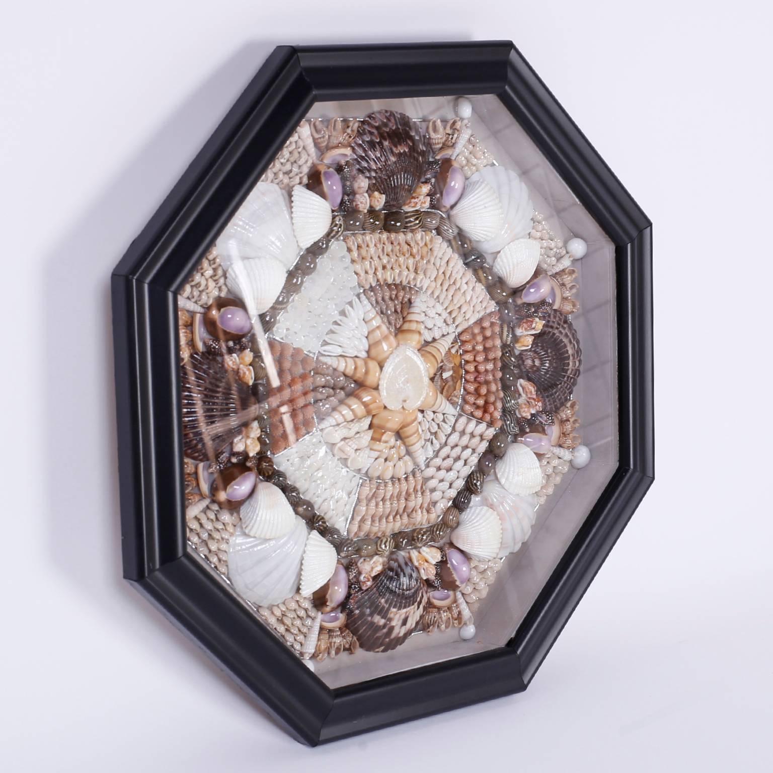 Sailors Valentine crafted with patience and care as a romantic offering displaying sea shells in a dynamic kaleidoscope pattern using multiple specimens.
