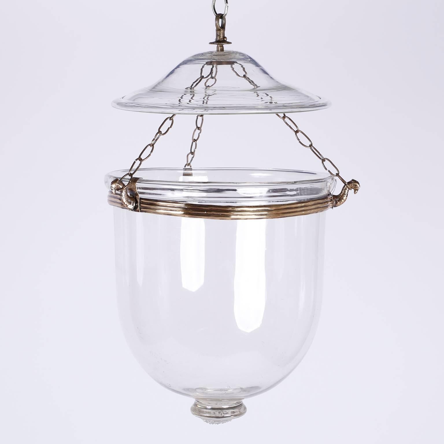 Pair of 19th century Georgian style bell jar lights or pendants with smoke bells in classic form and featuring animal head chain hooks and handblown bell shades. Ex-collection of the late E. Charles Beyer, head of English and French furniture,