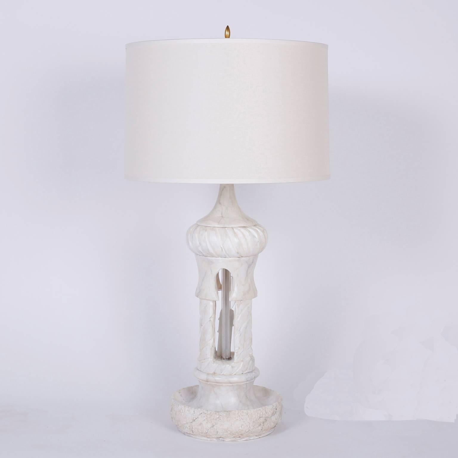 Pair of alabaster table lamps carved into Moorish architecture with domes and arches. Featuring candelabra mood lighting inside the dome. Newly wired.