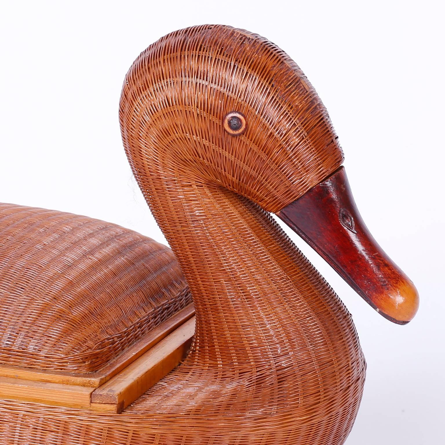 Wicker duck box from the Shanghai collection with its notorious intricate wicker structure, removable lid, carved beak, and bamboo trim.