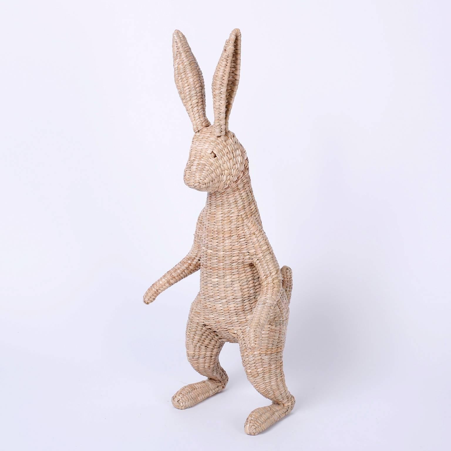 Midcentury rabbit with an amusing fairy tale inspired presence. Constructed with wicker reed over a metal frame. Signed Mario Torres 1974 on a brass medallion. Contemporary.

 