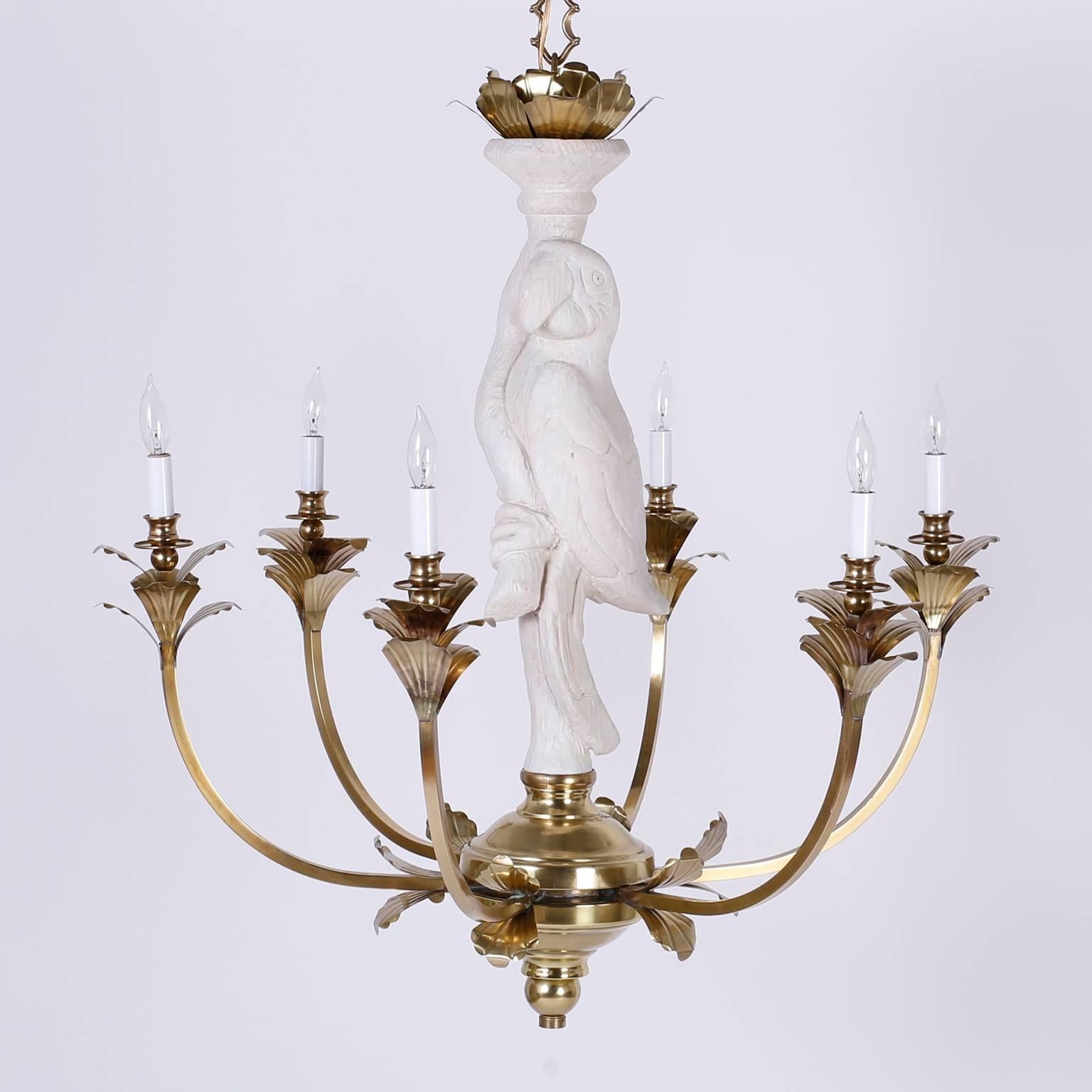 A whimsical, midcentury brass and carved wood parrot, six-arm chandelier with acanthus leaf trim accents. Sophisticated and tropical, this fixture manages to be traditional and modern all in one. Newly wired and gently polished.

 