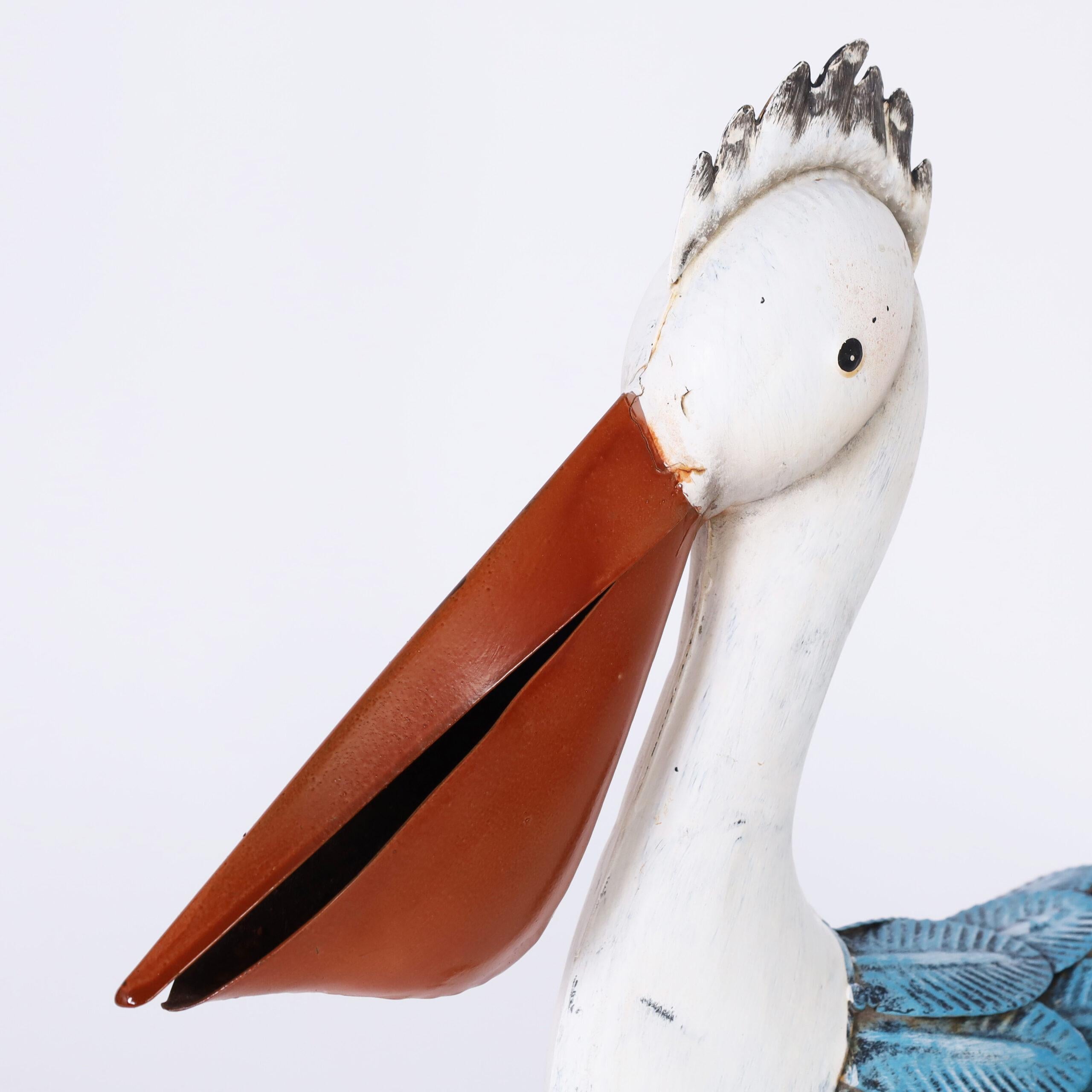 Pair of Folk Art Painted Metal Pelican Sculptures In Good Condition For Sale In Palm Beach, FL