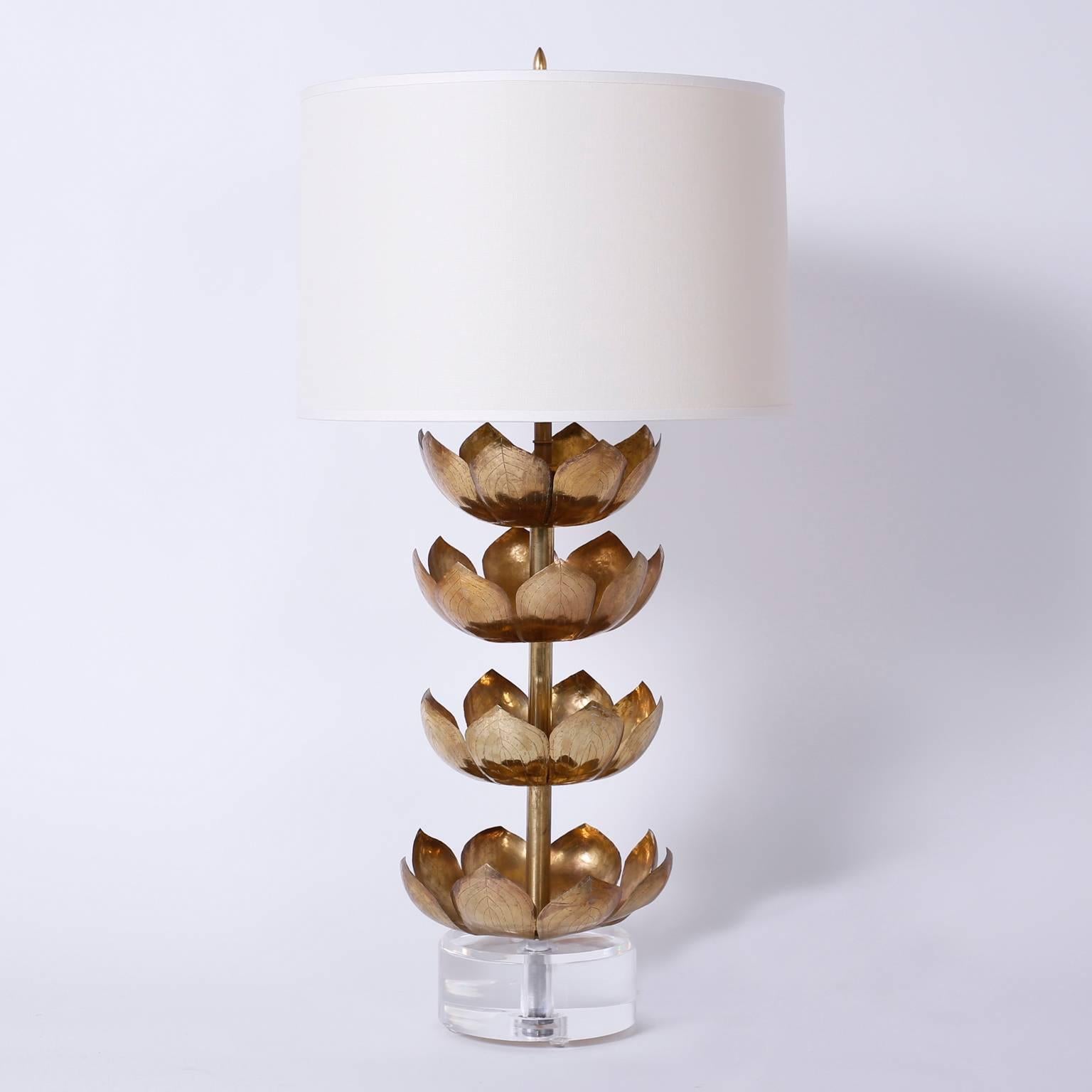 Pair of table lamps with a chic custom design by F. S. Henemader. Crafted with vintage Feldman style brass lotus leaves over thick round Lucite bases.