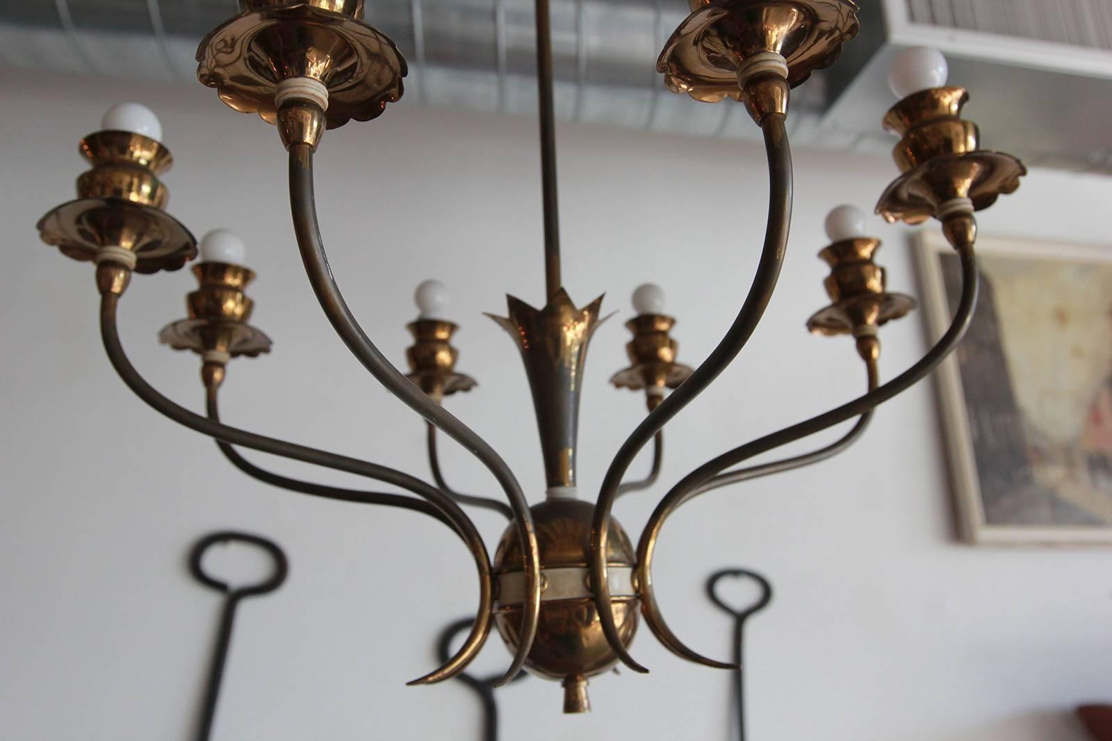 Italian brass eight-arm chandelier with fruit details.
