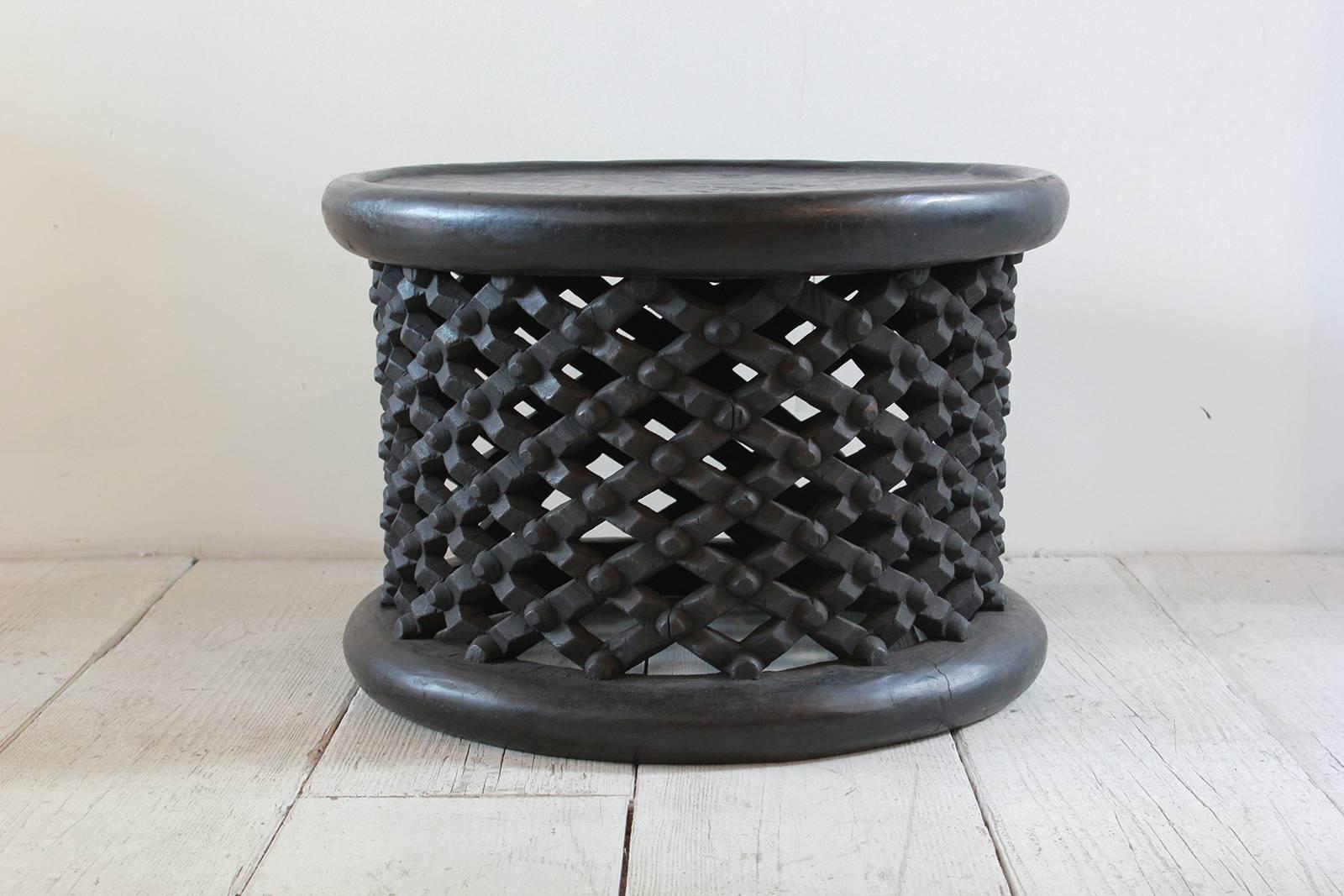 Dark stained African drum table.
