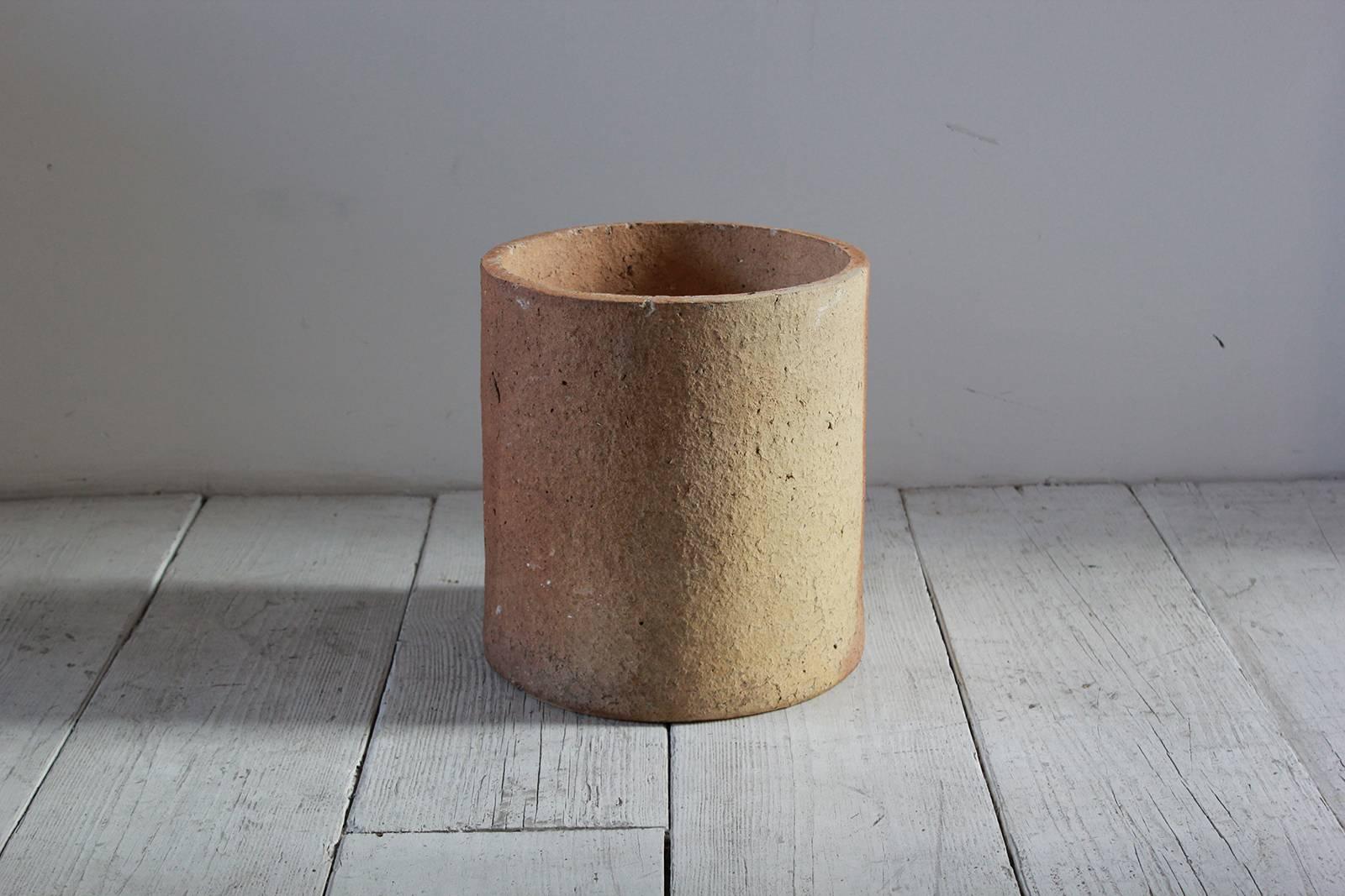 Round cylindrical cement planter see various patina age to the color.