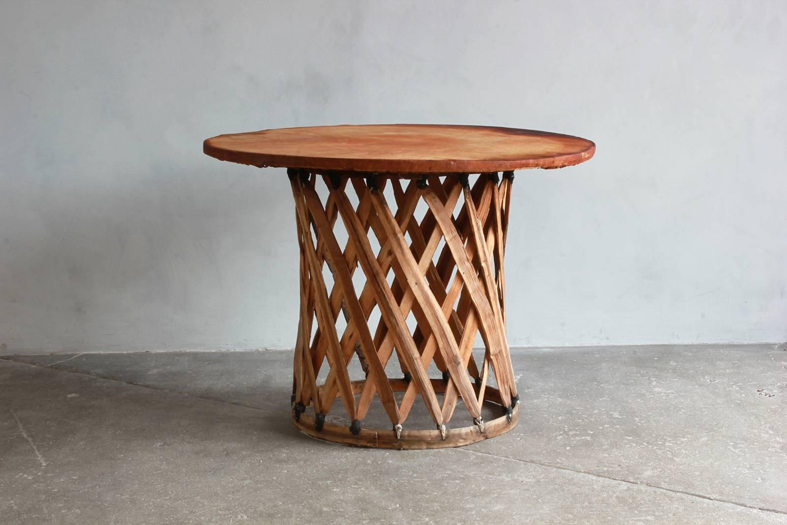 Mexican leather wrapped round table with four Equipale chairs. Chair dimensions are: 24.5