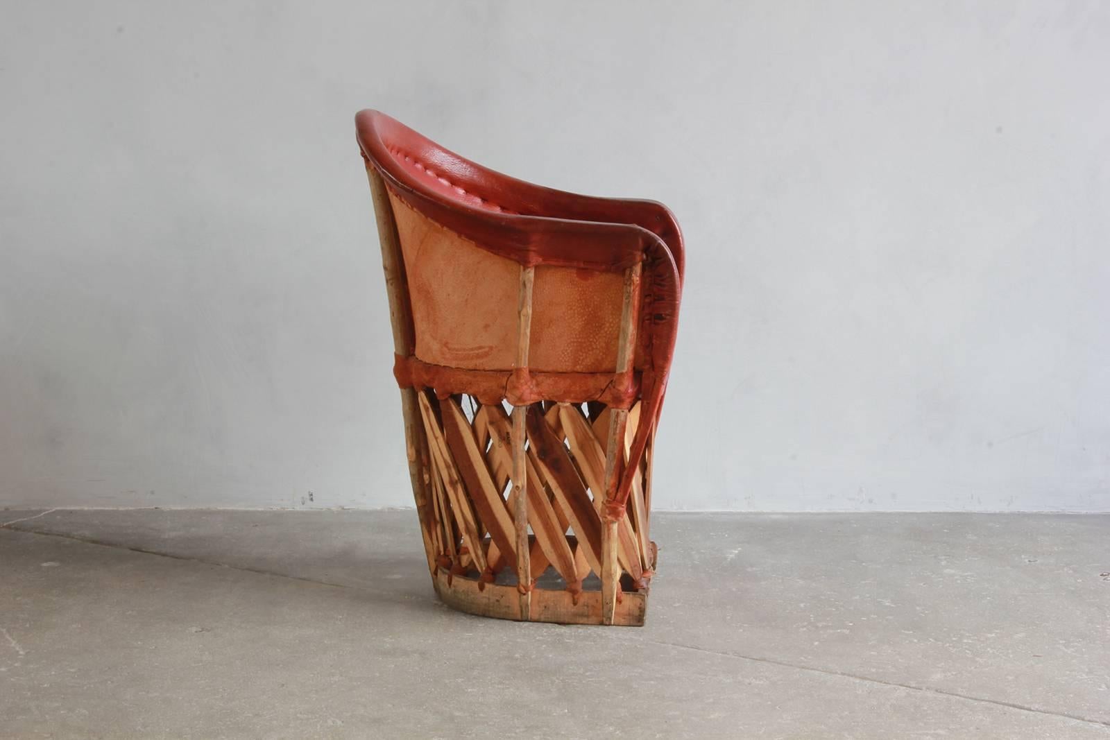 Set of four Mexican Equipale wood and leather chair. (Three sets available, 12 chairs total).
