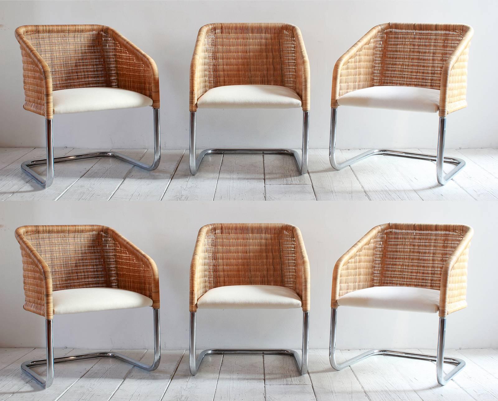 Set of six Harvey Probber style wicker and chrome basket chairs with a newly upholstered linen seat cushion.