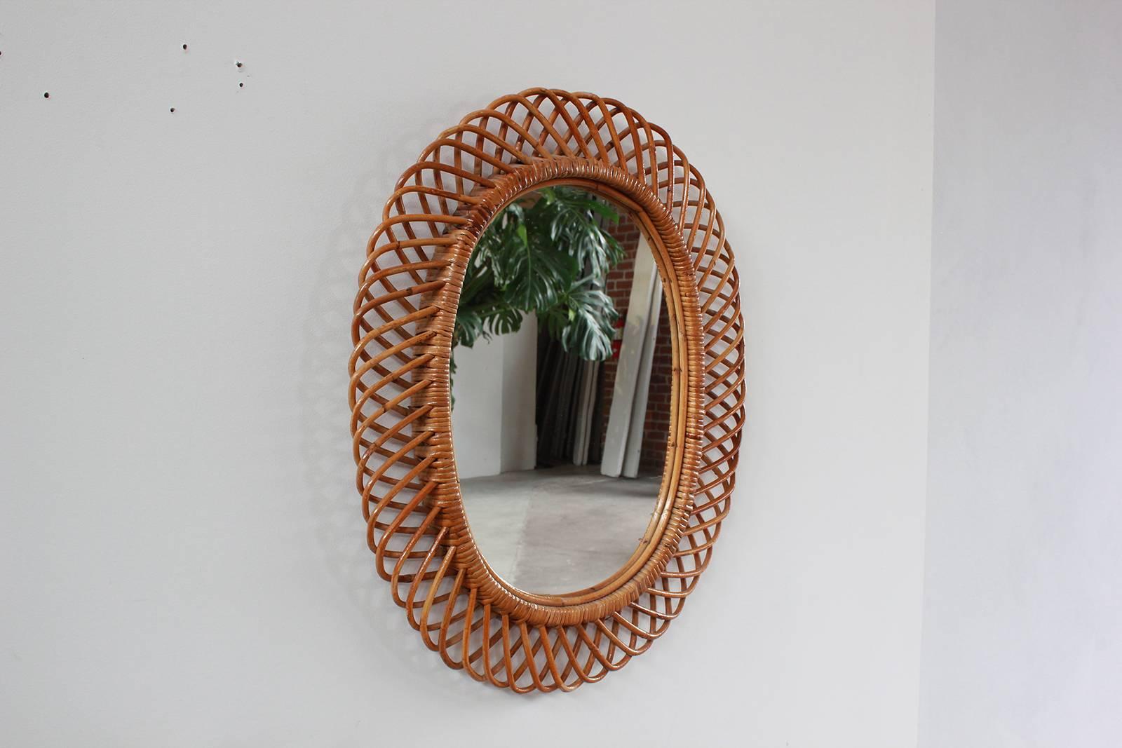 Beautiful oval intricately detailed French wicker mirror.