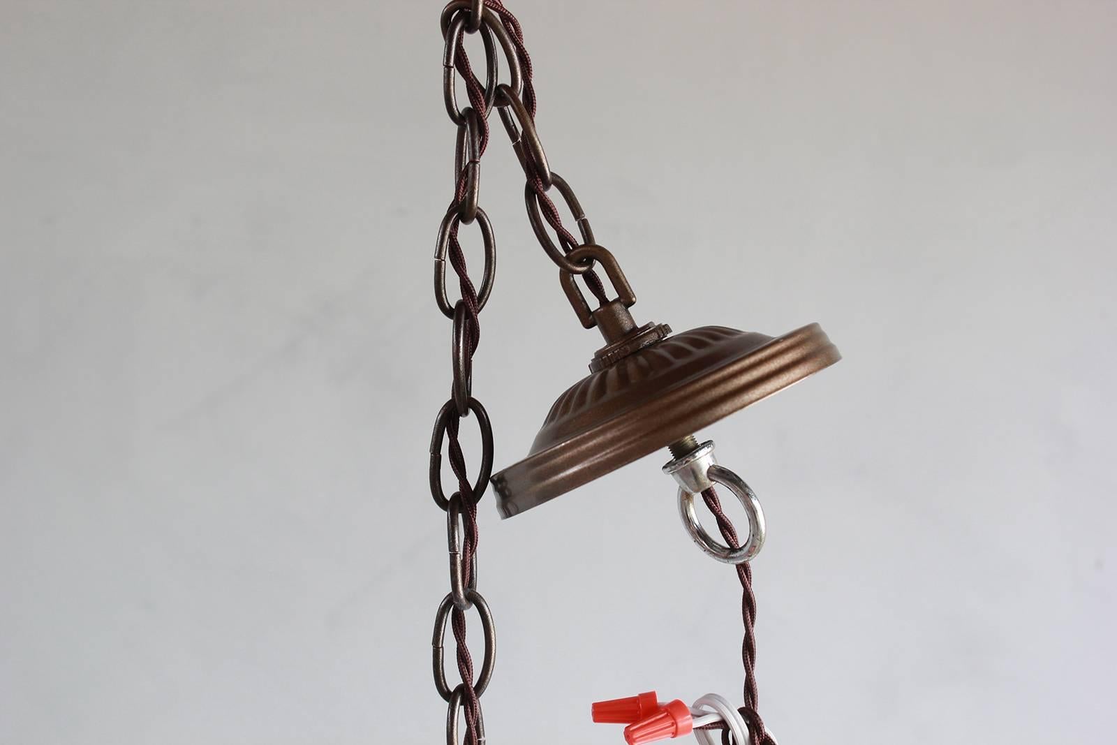 Pair of wooden rustic pendants with brass chain.