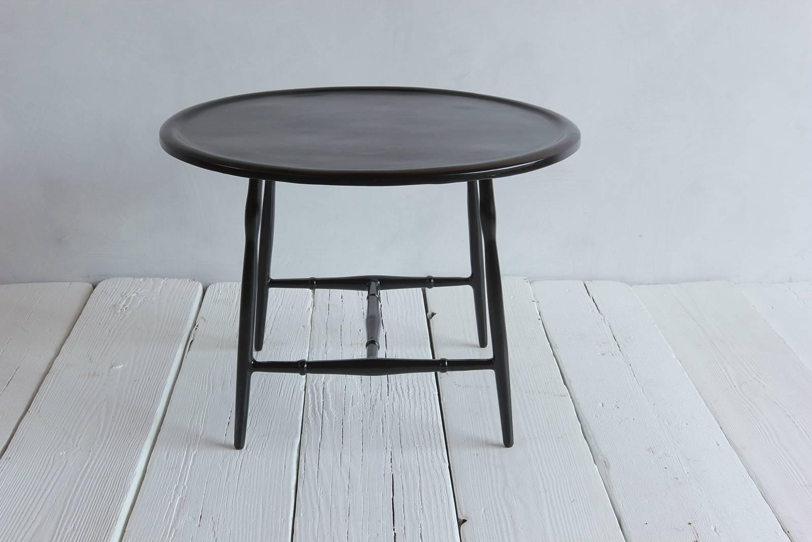 Solid cast metal outdoor Windsor cocktail table.