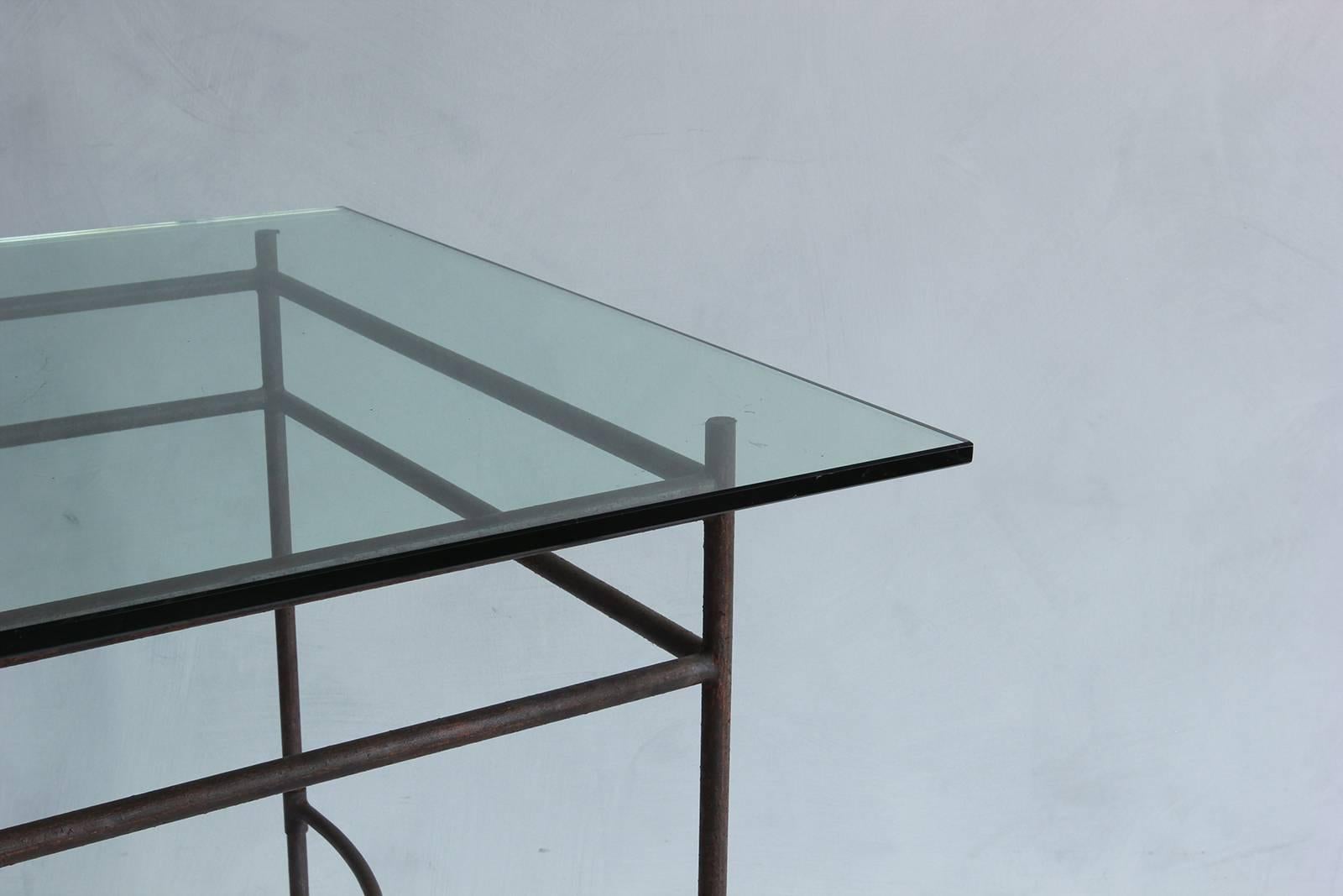 Tall iron and glass table.
