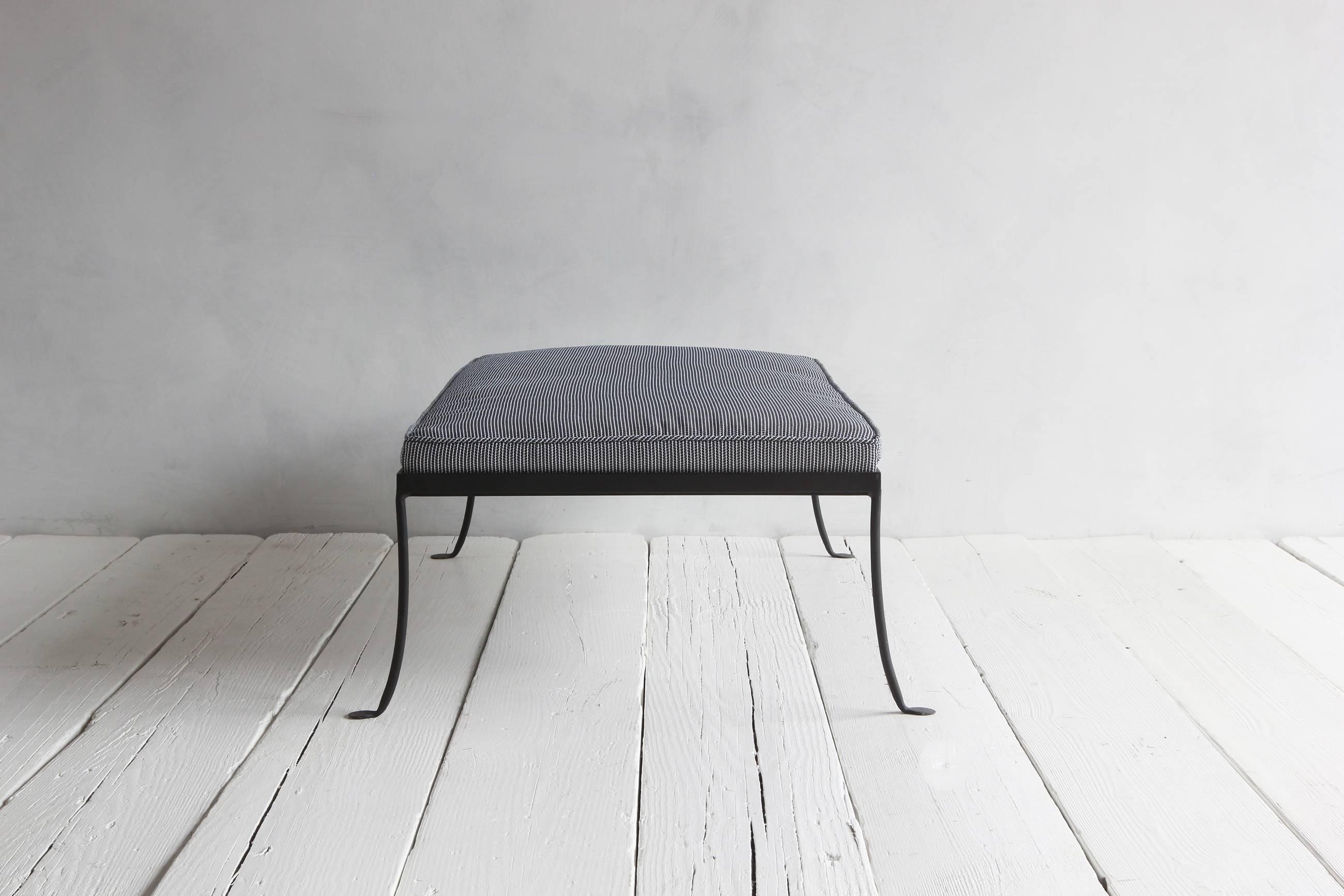 NK collection outdoor wrought iron ottoman with newly upholstered cushion.