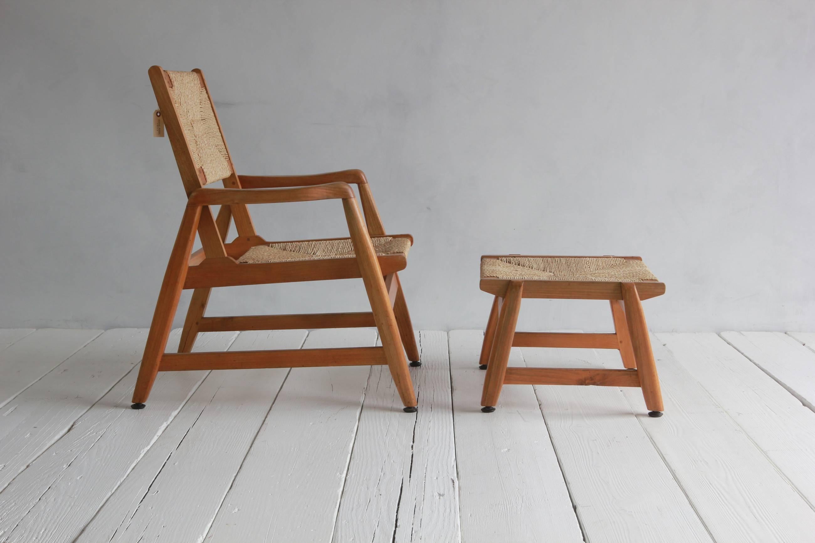 Danish wood framed chair and foot stool with woven rush details.

Foot stool measures: 20
