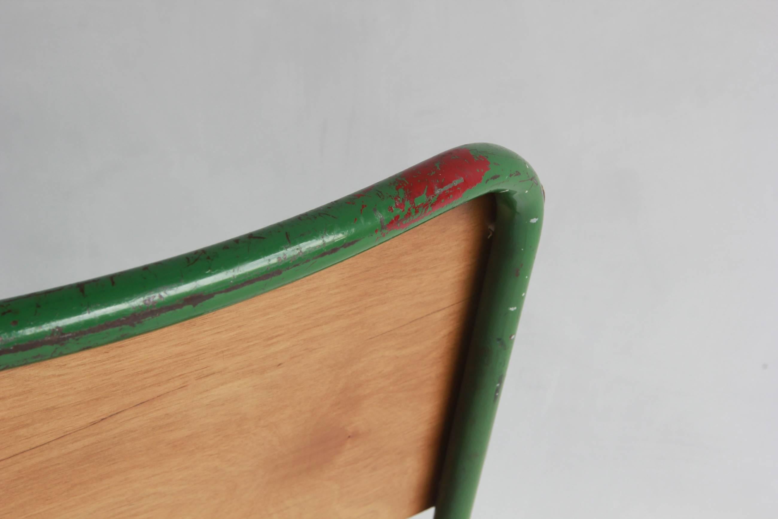 Prouve style green painted metal chair with wood seat and back.