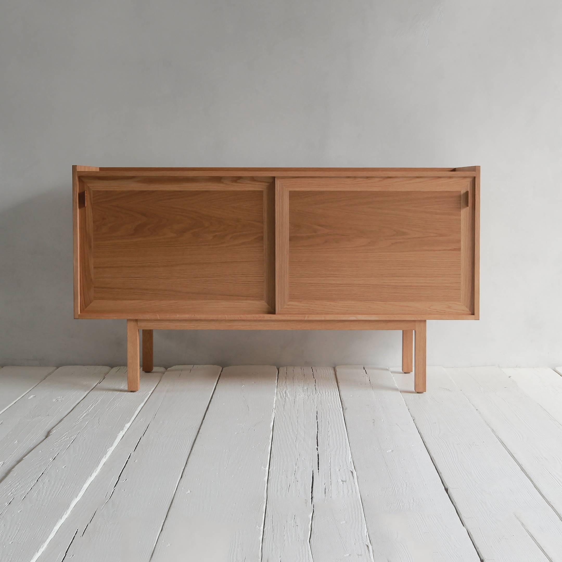 Handsome storage with modern proportions and a tribute to Scandinavian design, our credenza is a Classic addition to a furniture collection. Interior cabinets include adjustable shelves and three felt-lined open drawers. Made in Los Angeles.