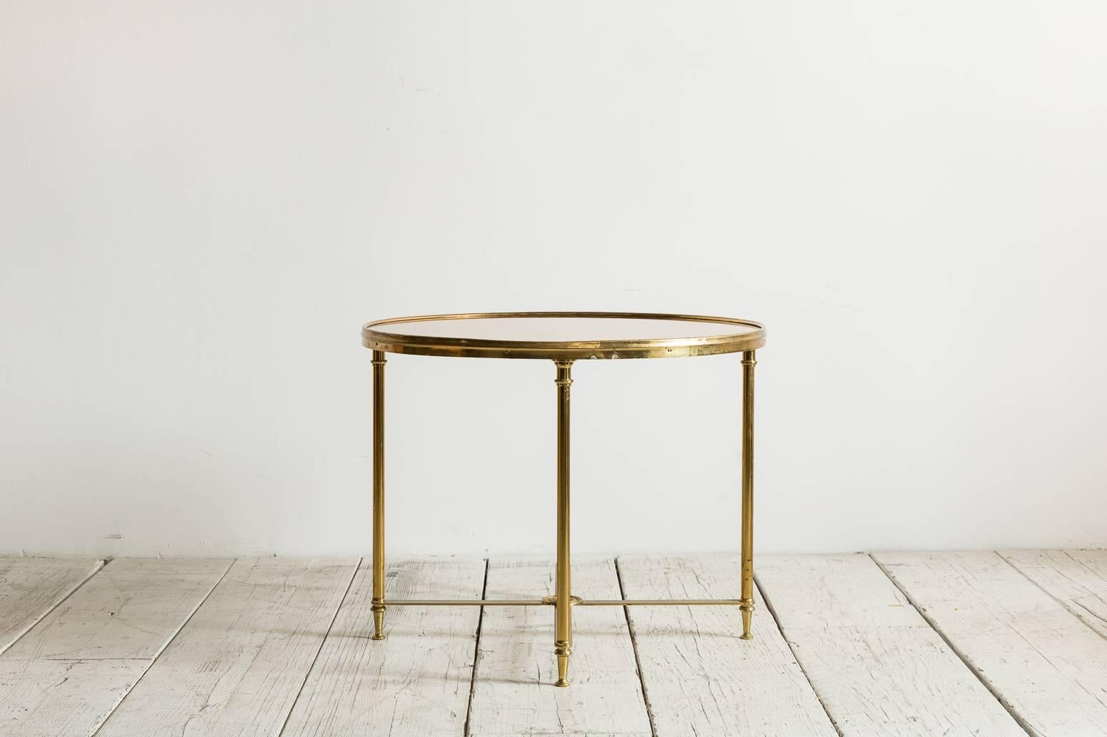 Brass framed rose mirror round side table from France.