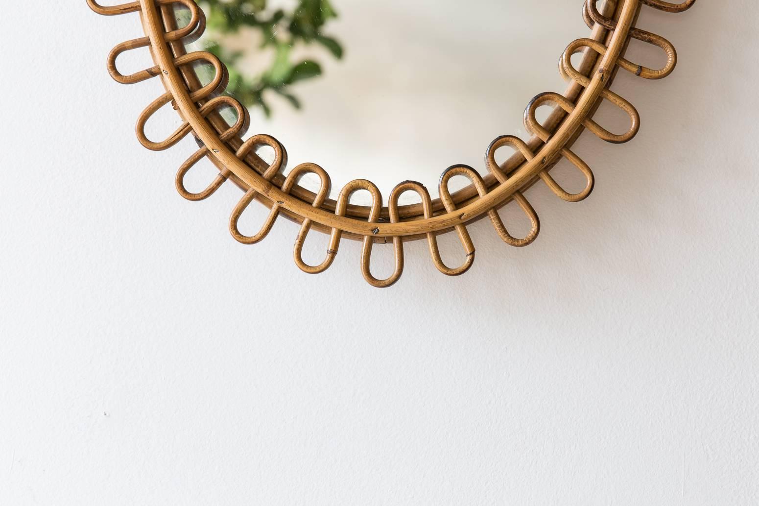 Curled oval wicker mirror from France.