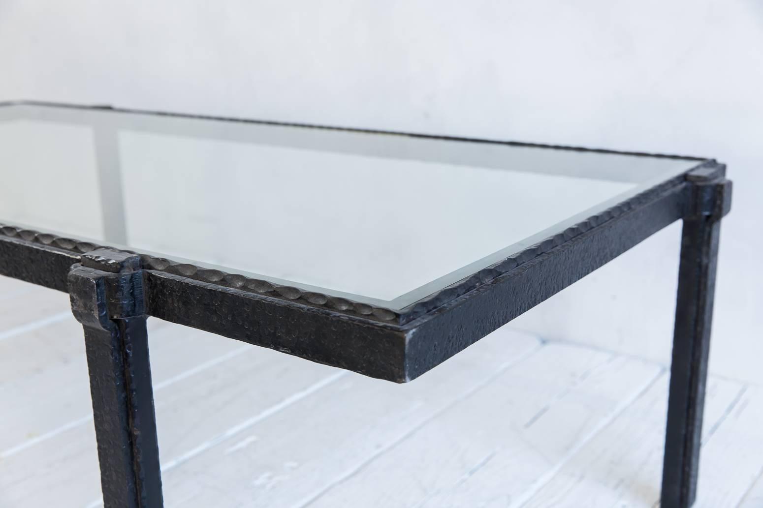 Rectangular Brutalist iron and glass cocktail table.