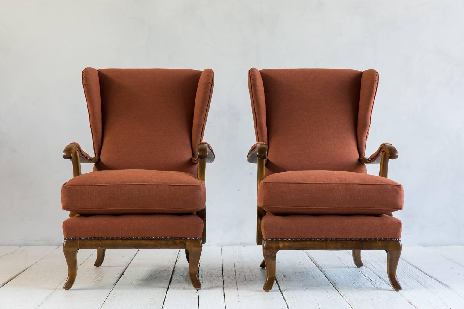 Vintage Italian wing chair upholstered in rust riptsop Howe fabric.
